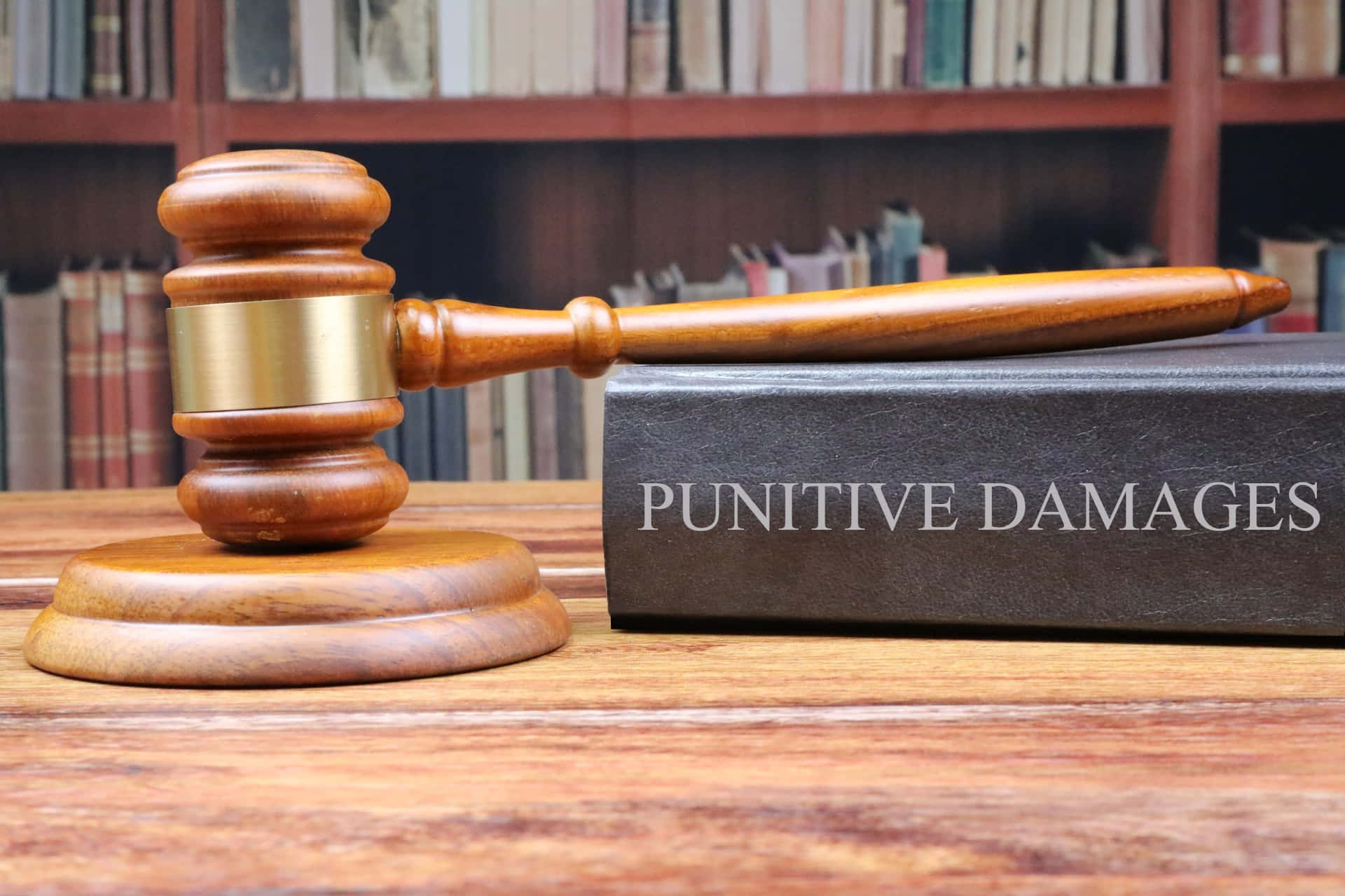 Punitive Damages Book With A Gavel Wallpaper