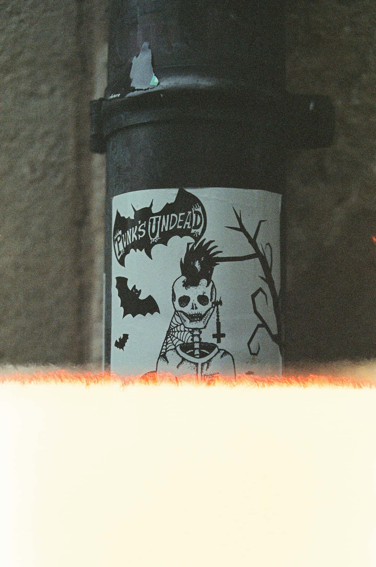 Punk Undead Sticker On Pipe.jpg Wallpaper