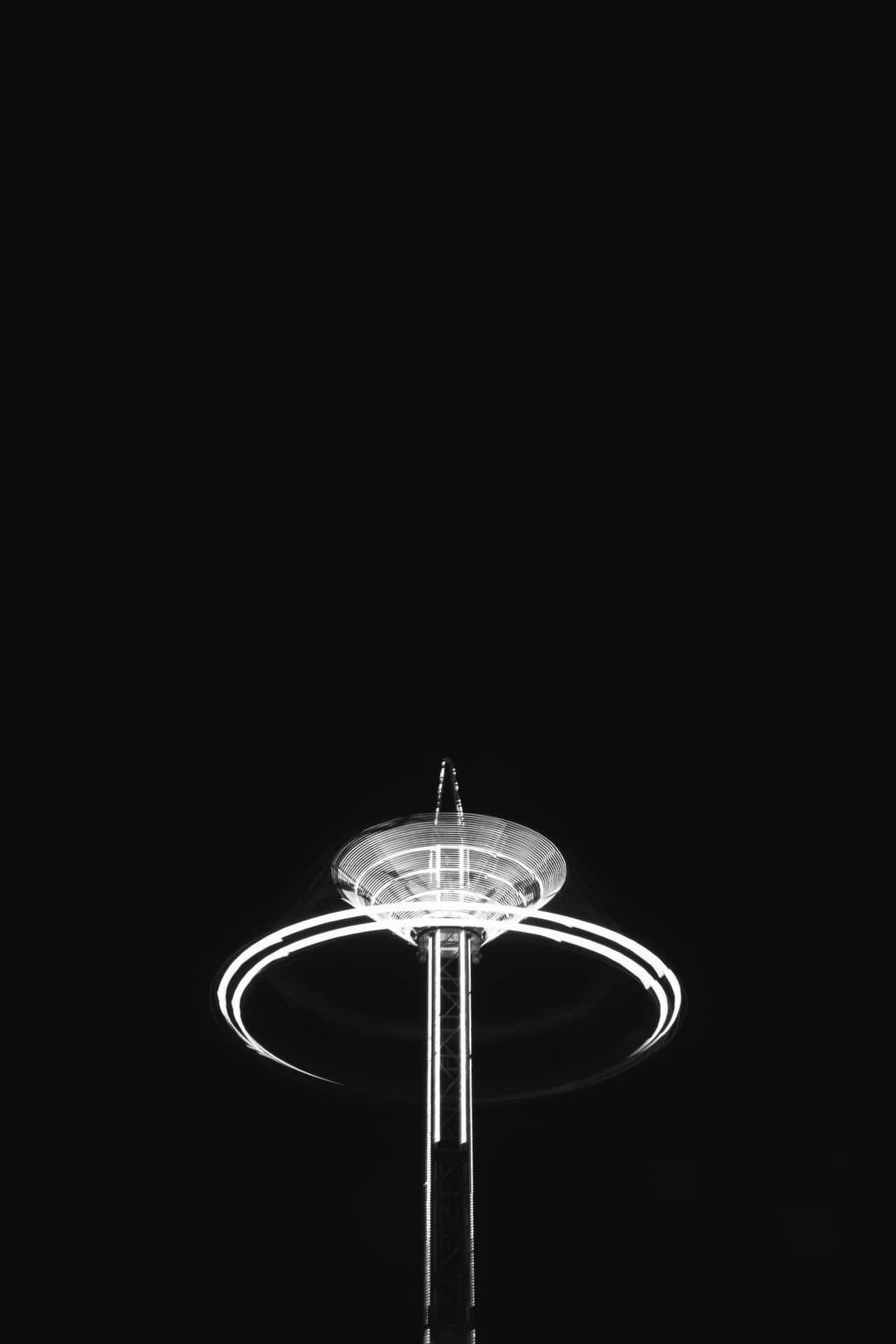 A Black And White Photo Of A Light Wallpaper