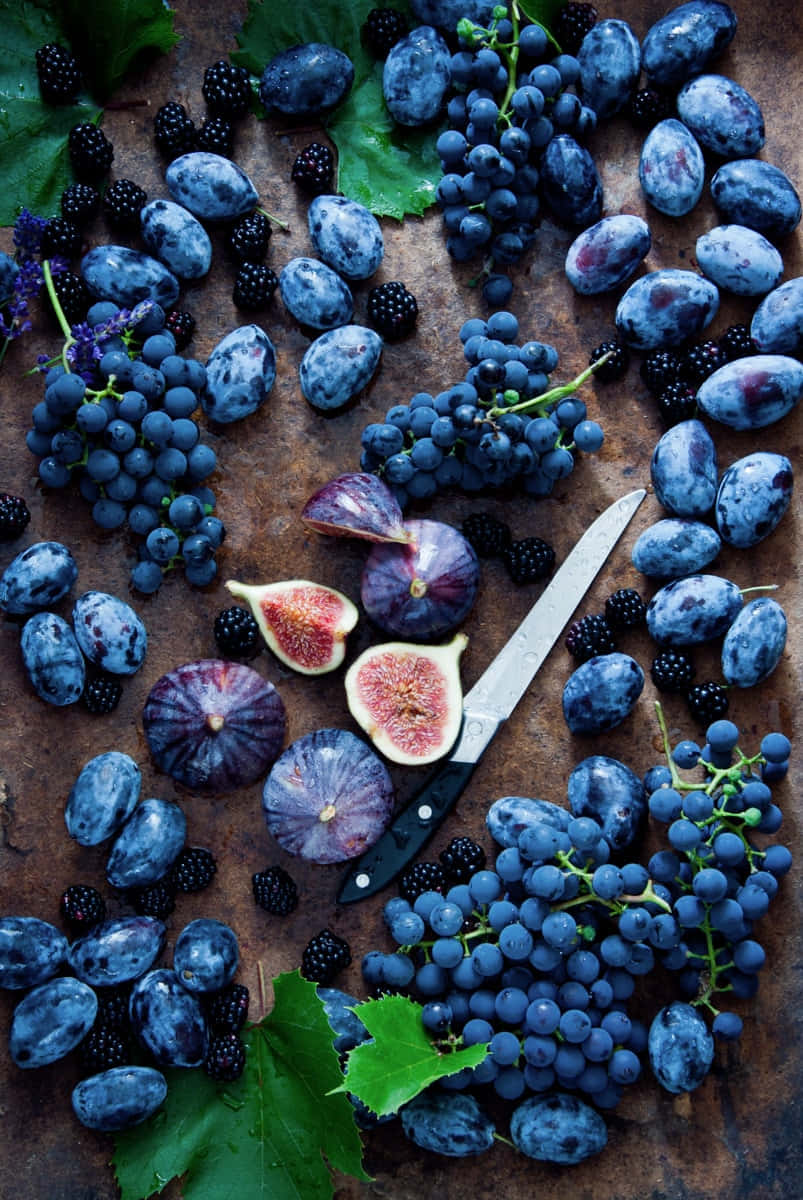 Purple Aesthetic Fruits On Brown Surface Picture