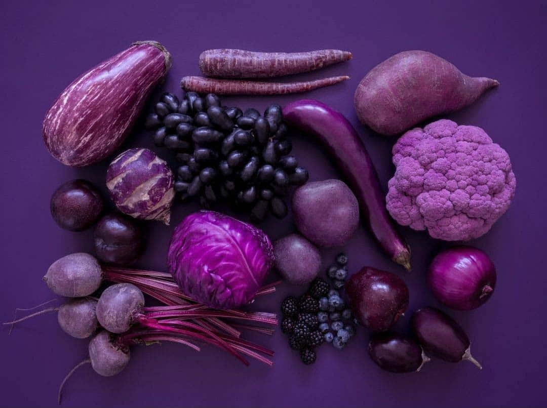 Purple Aesthetic Vegetable And Fruits On Purple Surface Picture