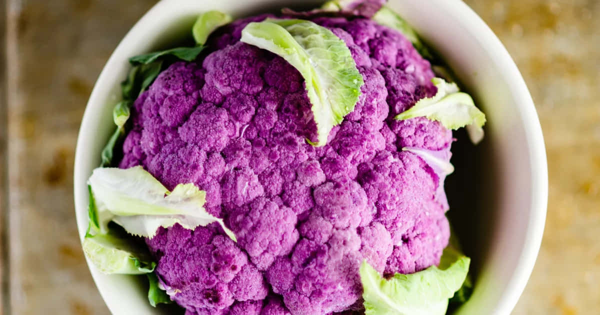 Enjoy the Beautiful Colors of Nature with Purple Cauliflower Wallpaper