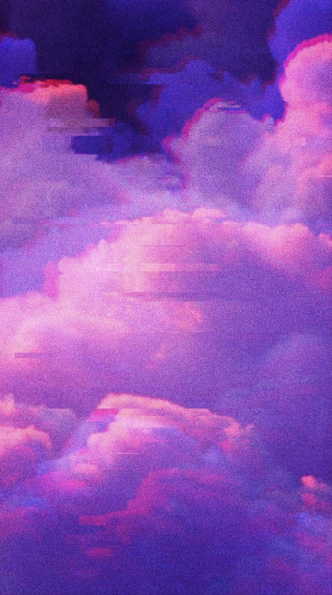 Einemalerische Aussicht Auf Den Himmel Bei Sonnenuntergang, Mit Lebendigen Violetten Wolken. Wallpaper