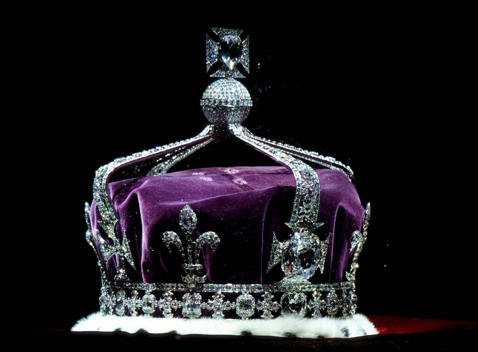 Shine like a diamond with this stunning crown of jeweled purple diamonds Wallpaper