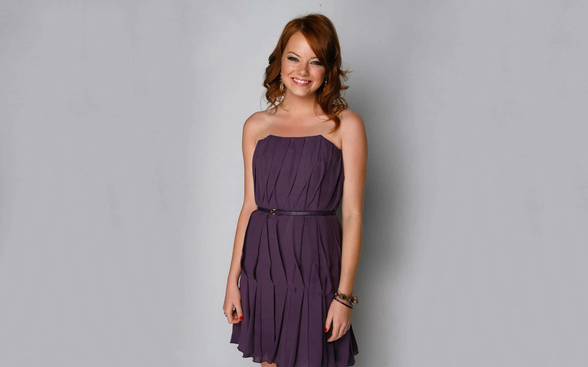 Accentuate your curves with this plunging V-neck, floor-length purple dress. Wallpaper