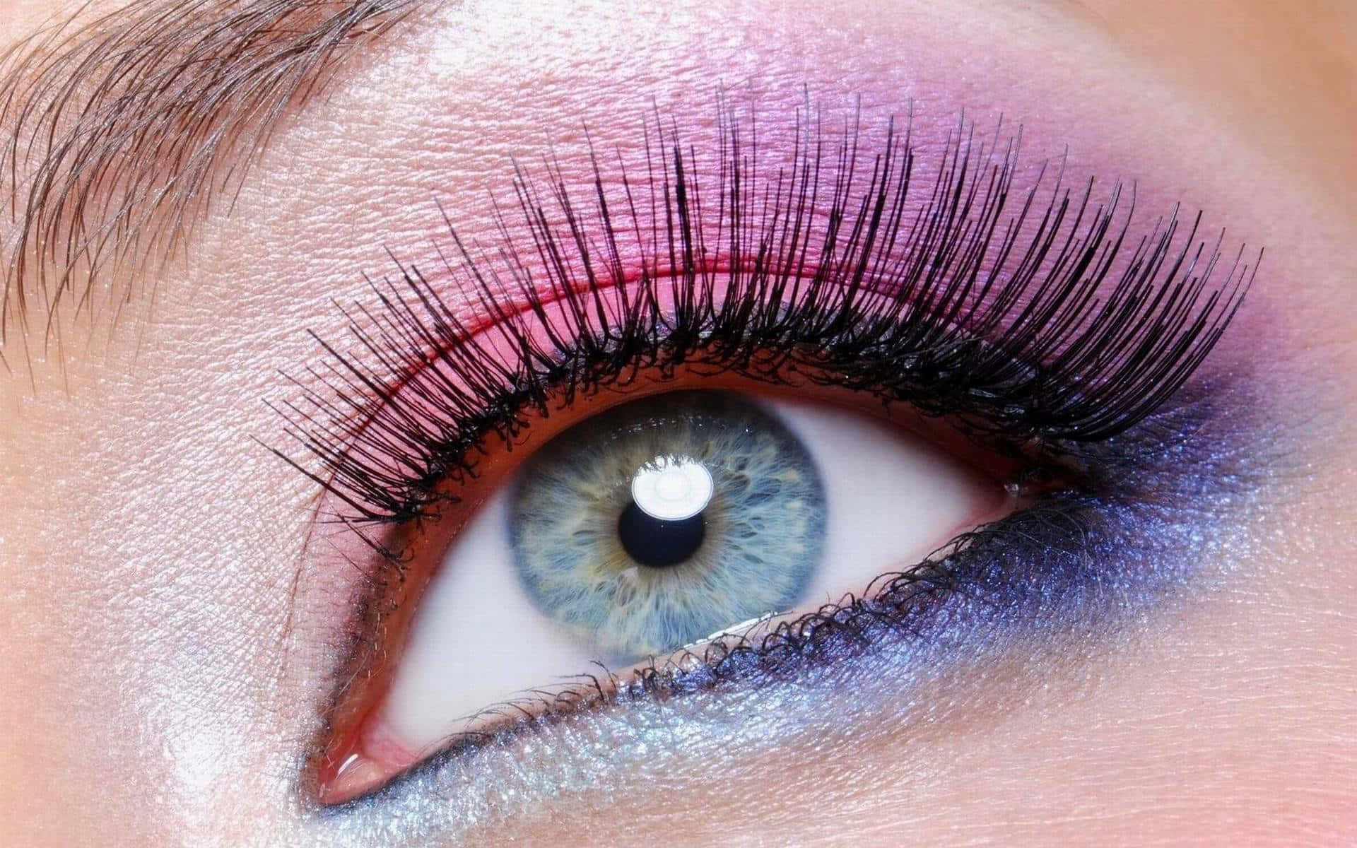 Create a sultry and alluring gaze with a subtle pop of purple eye shadow Wallpaper