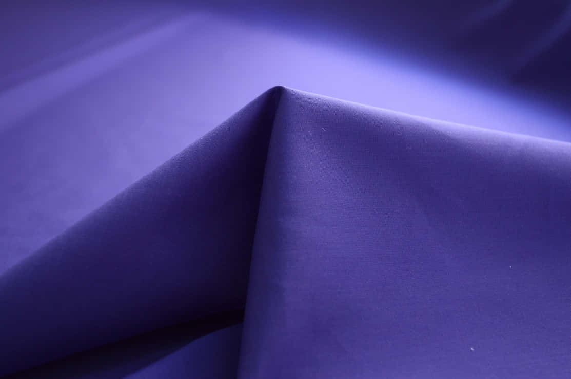 "Experience Comfort and Luxury with Purple Fabrics" Wallpaper