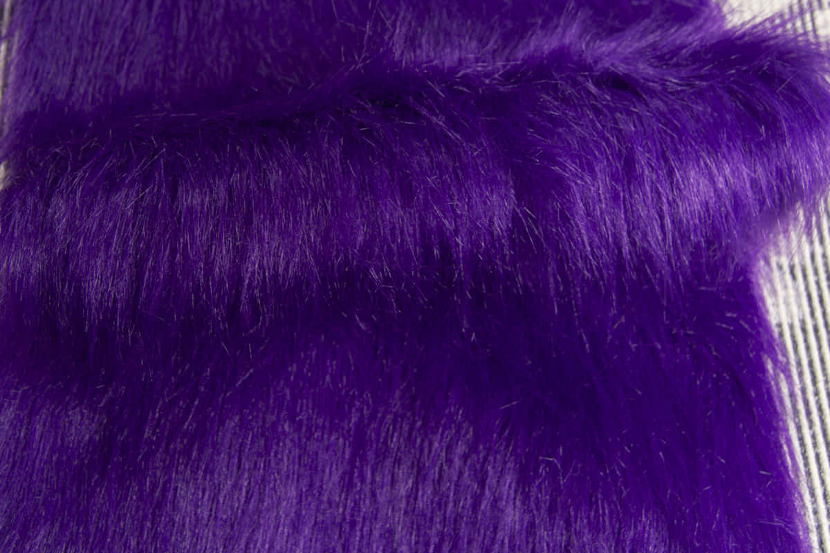 Soft and lush, this bright purple faux fur brings a fun and stylish look to any home! Wallpaper