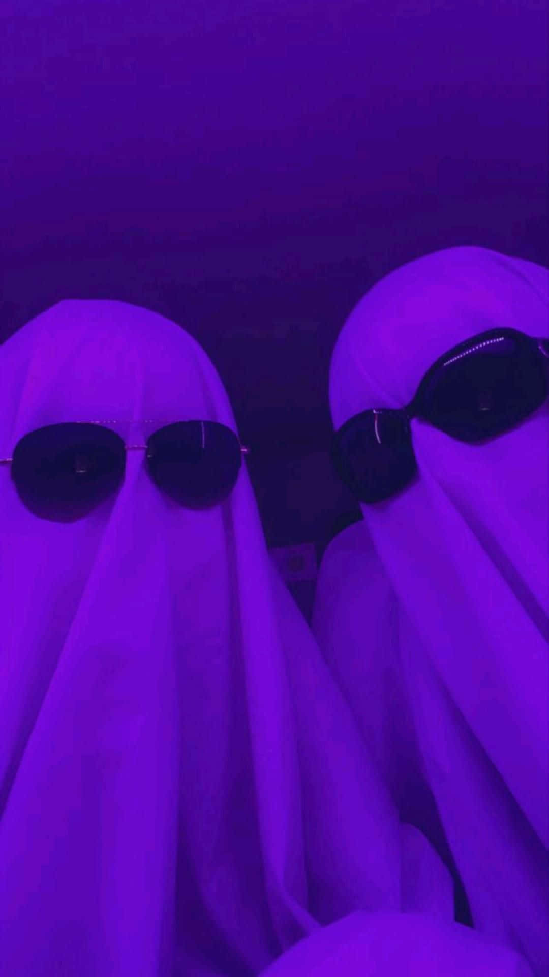 Purple Ghostly Figures Halloween Aesthetic Wallpaper