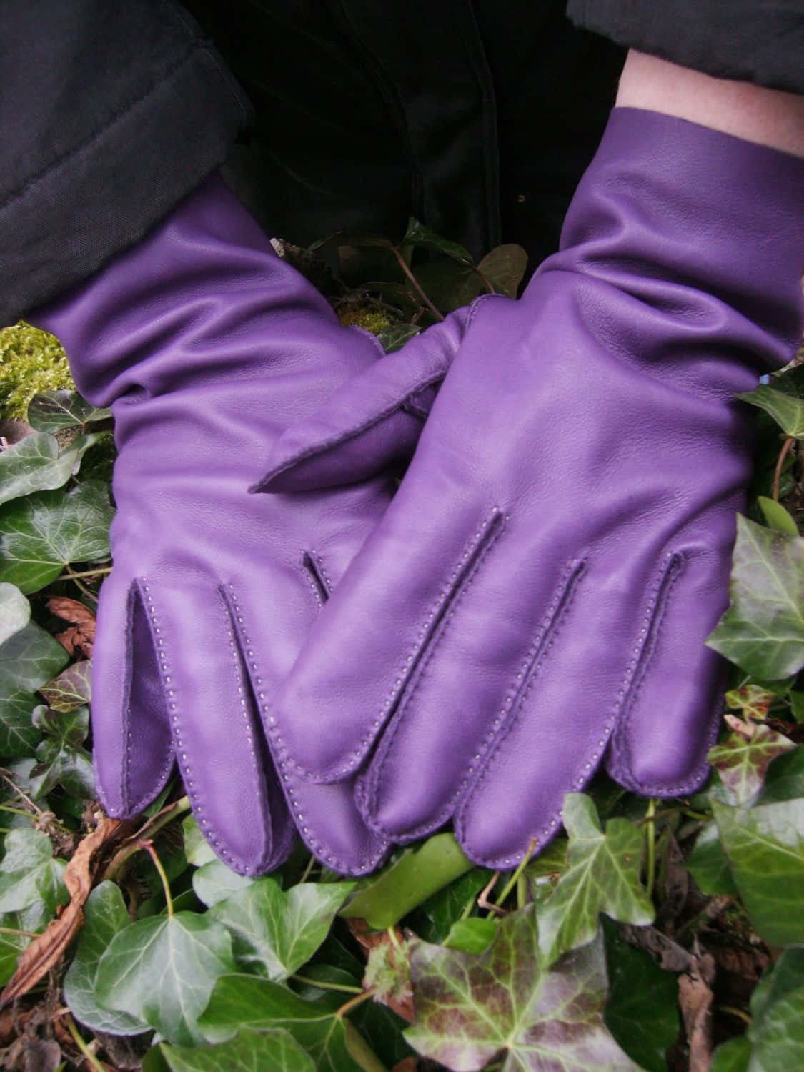 A pair of lavender satin evening gloves Wallpaper