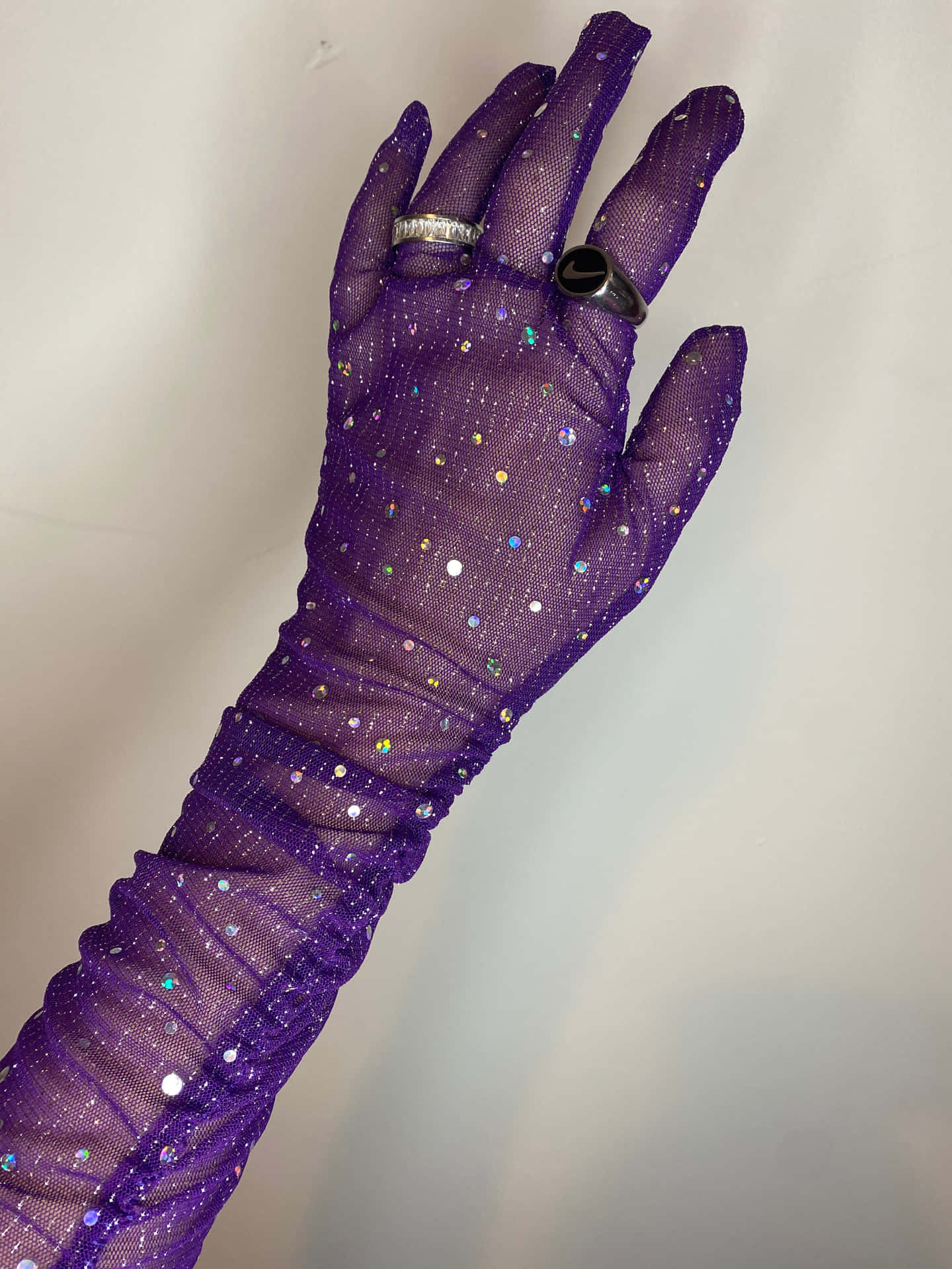 Add a pop of color to your wardrobe with Purple Gloves. Wallpaper