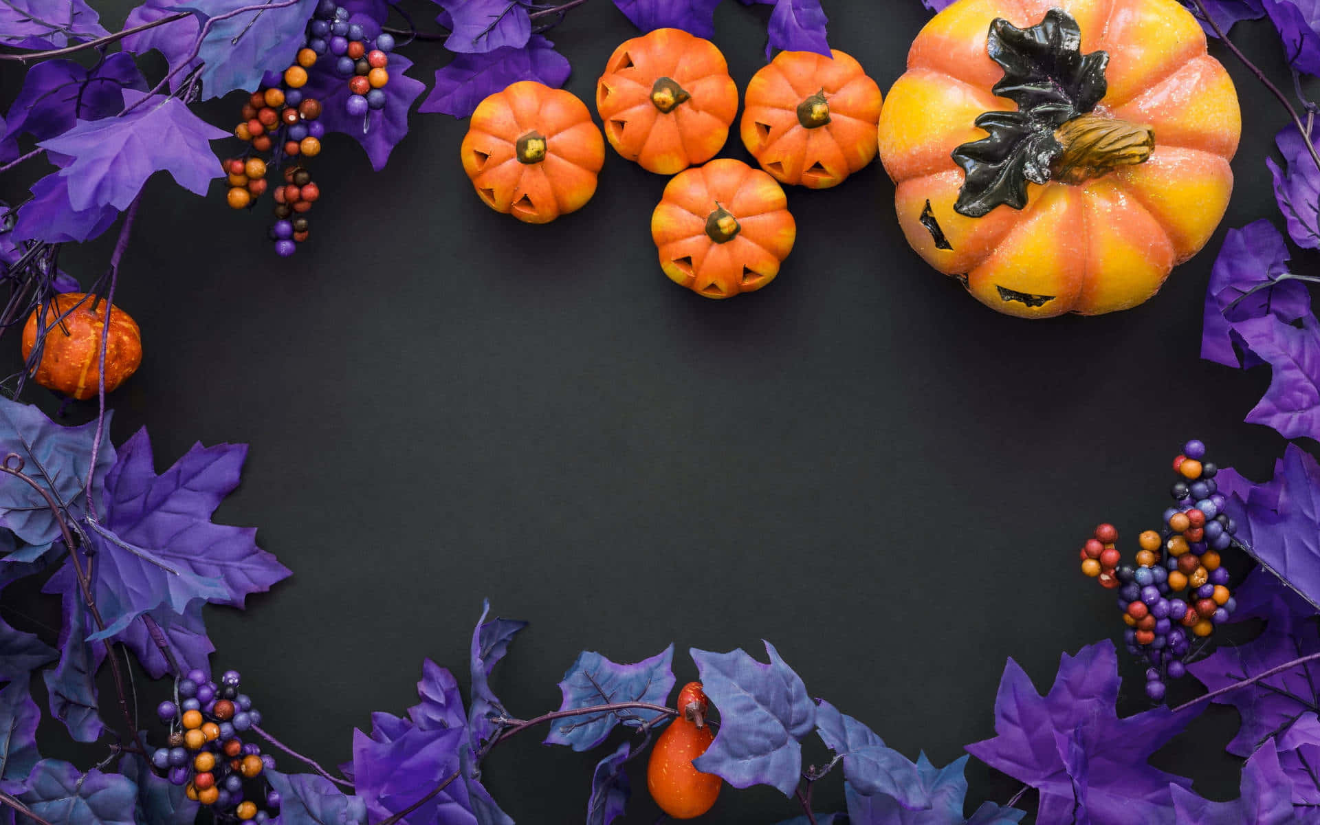Purple Halloween Themewith Pumpkinsand Leaves Wallpaper
