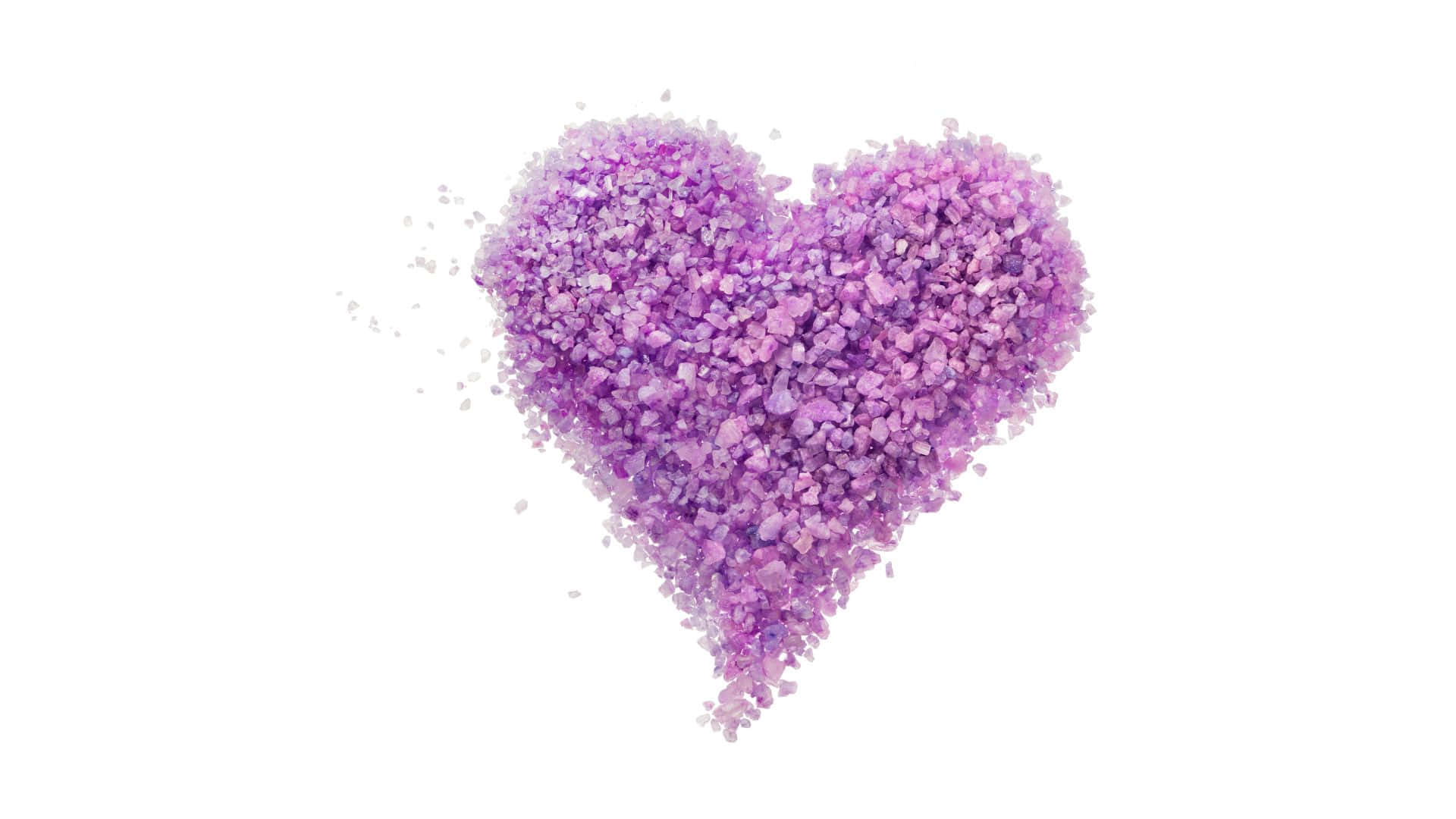 A Heart Made Of Purple Flowers On A White Background