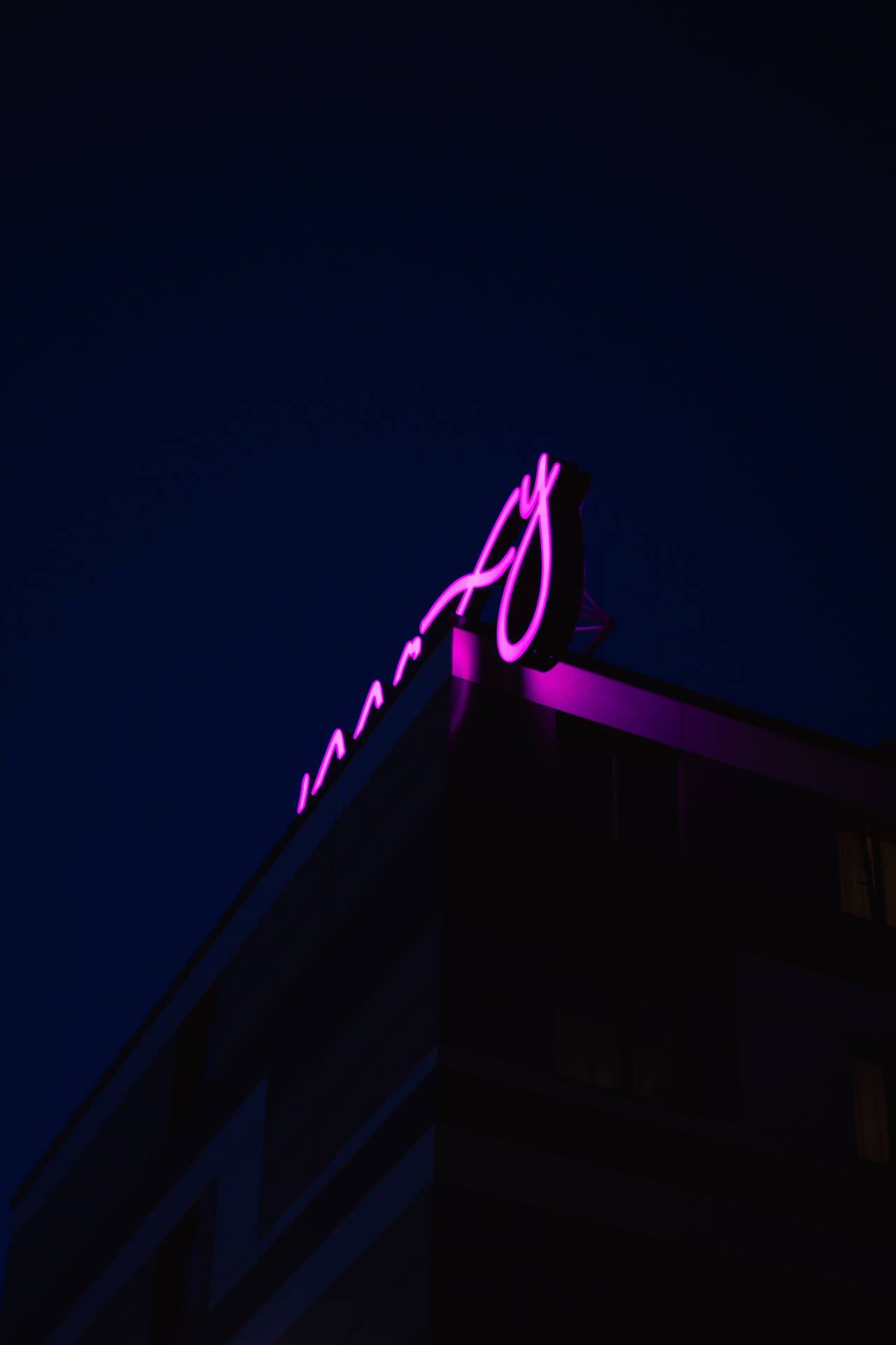 Purple Neon Sign On Roof Wallpaper