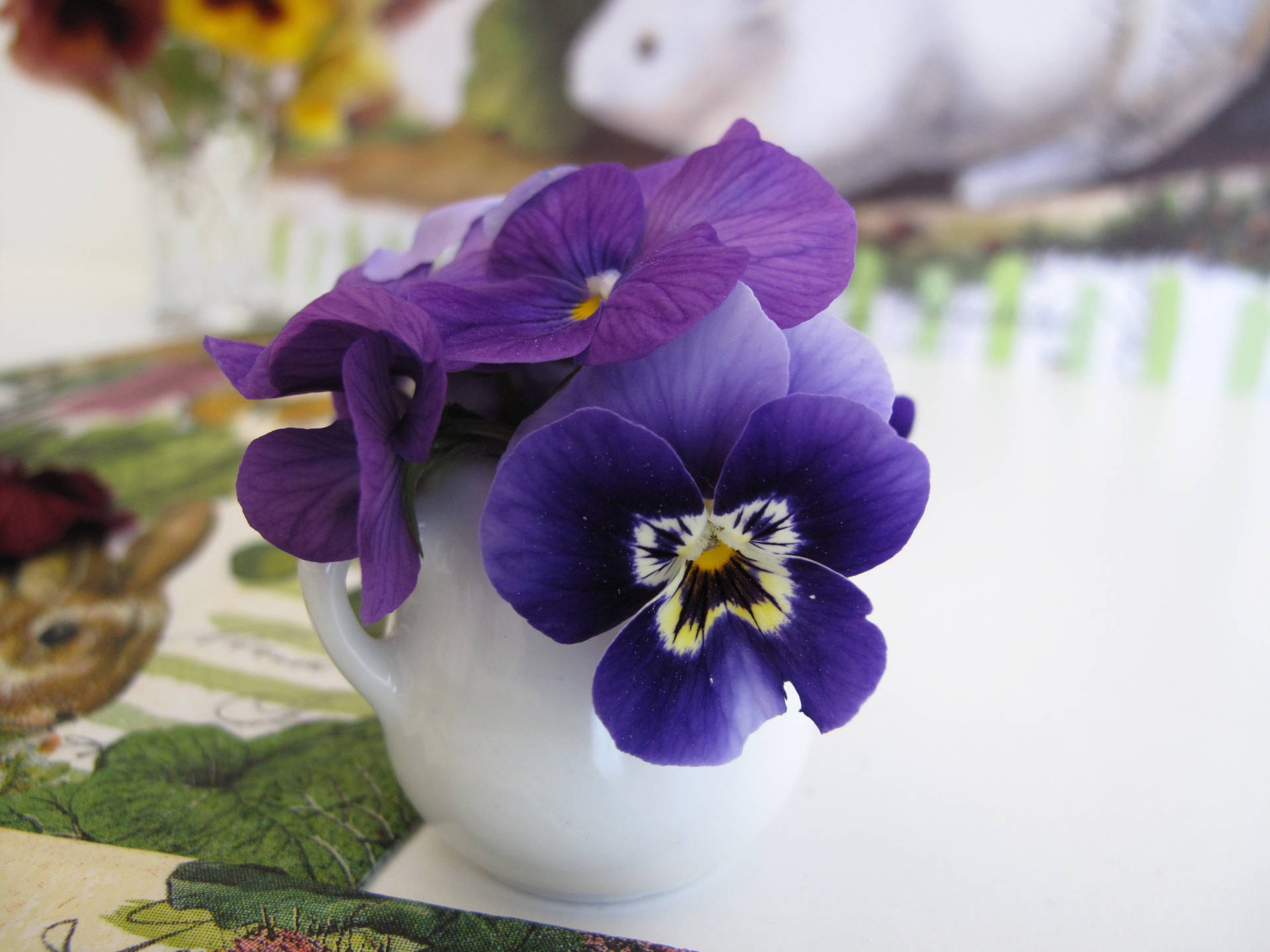 Purple Pansy On White Vase Wallpaper