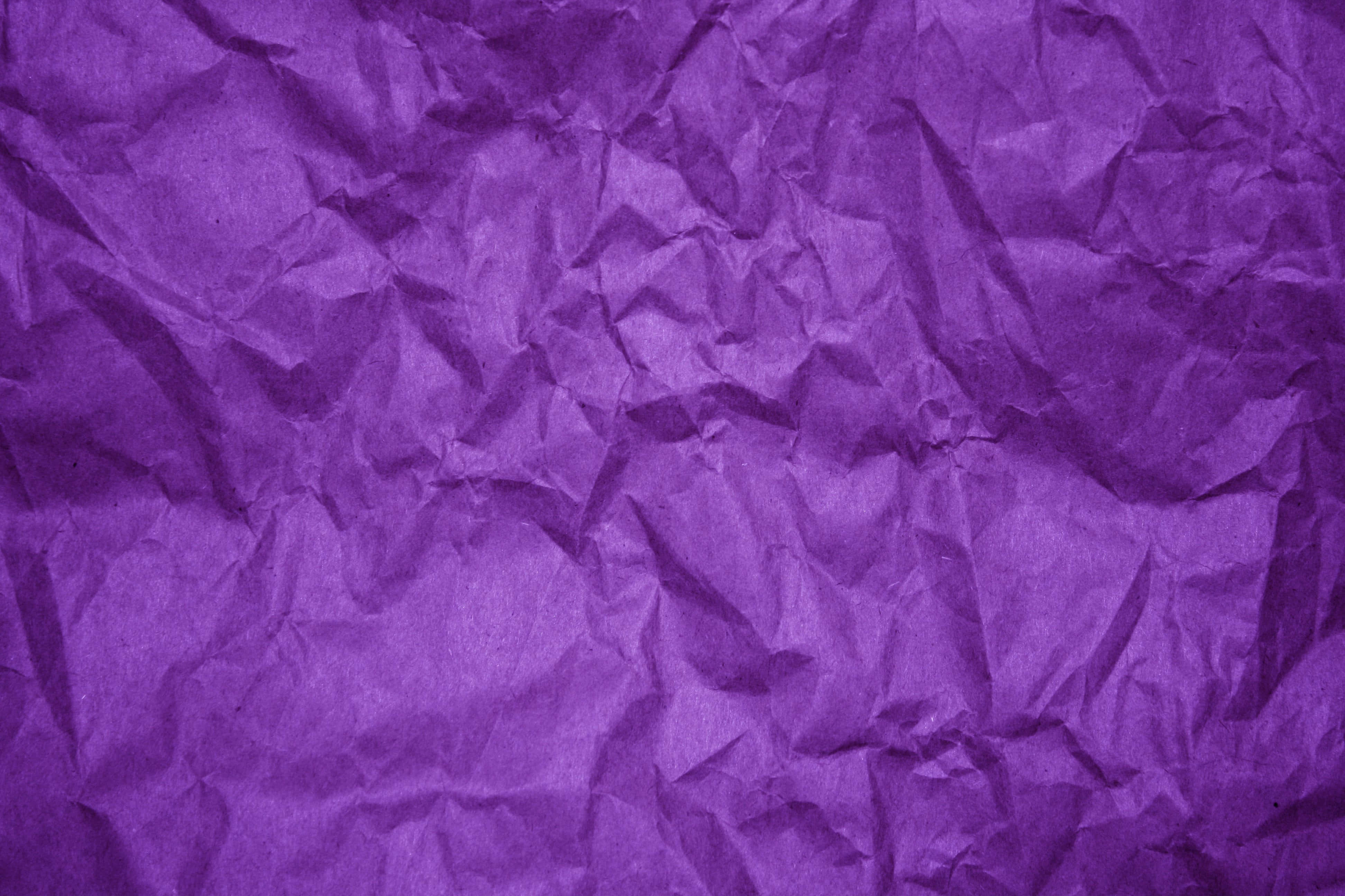 This high-quality wallpaper features a beautiful abstract pattern of bold, purple hues. Wallpaper