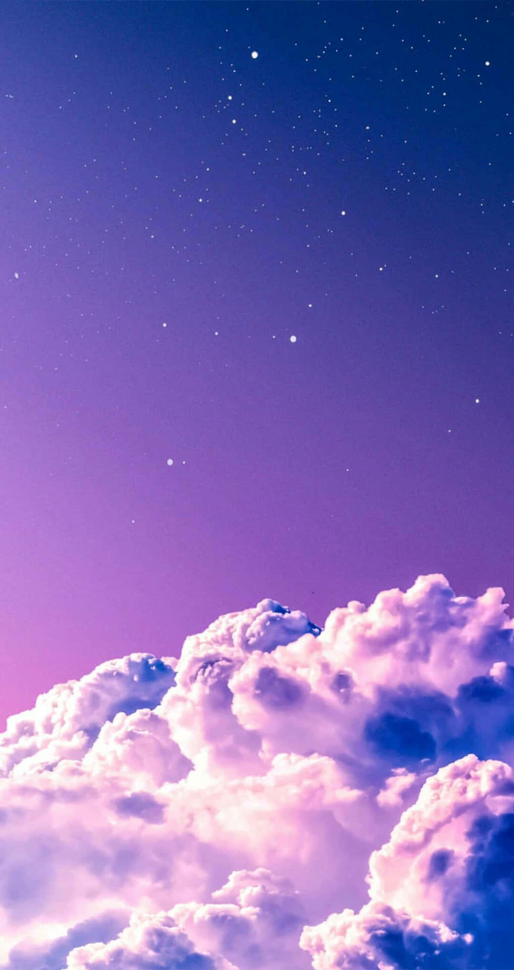 A Purple Sky With Clouds And Stars Wallpaper