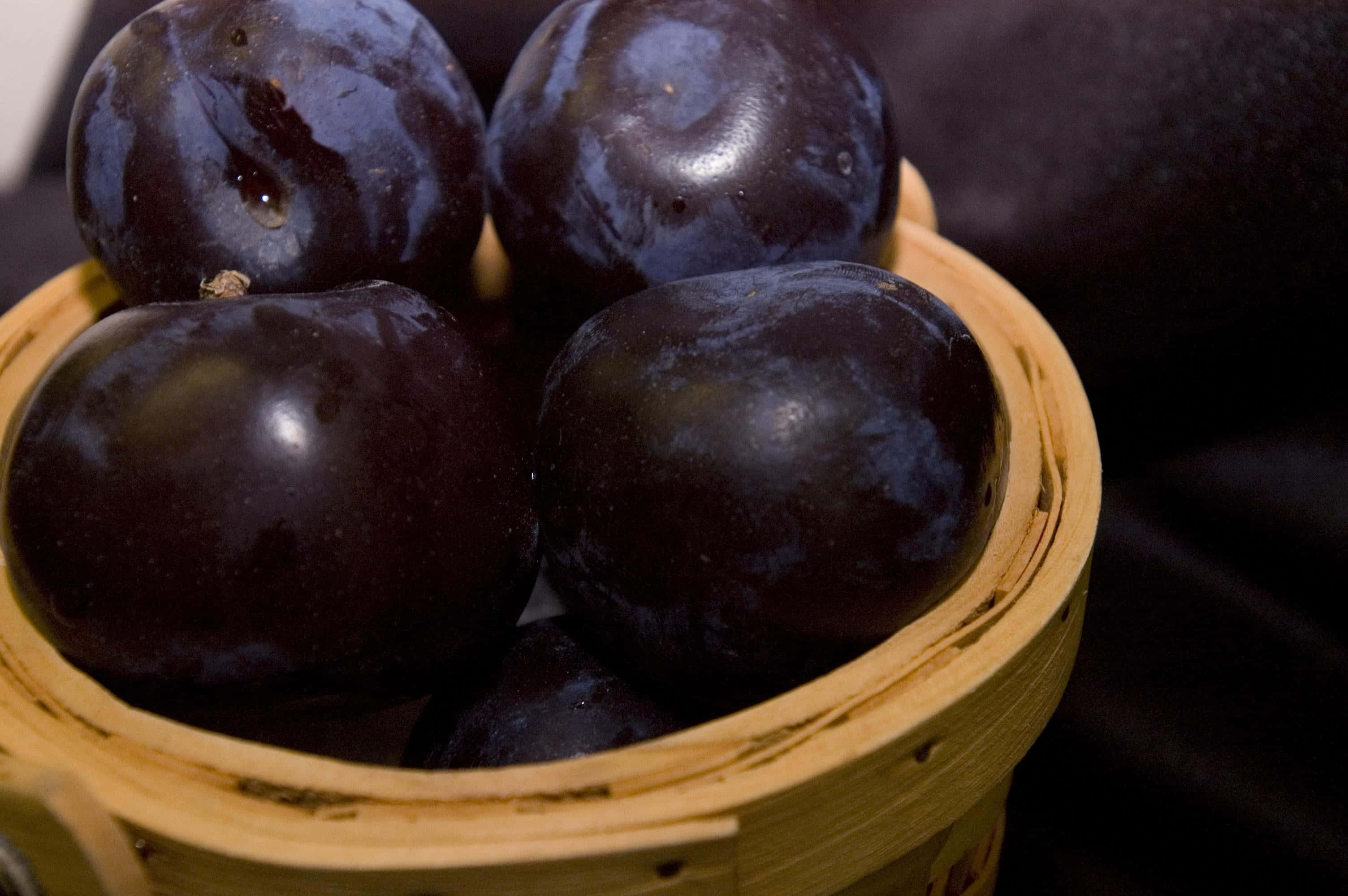 Plump and juicy purple plums Wallpaper
