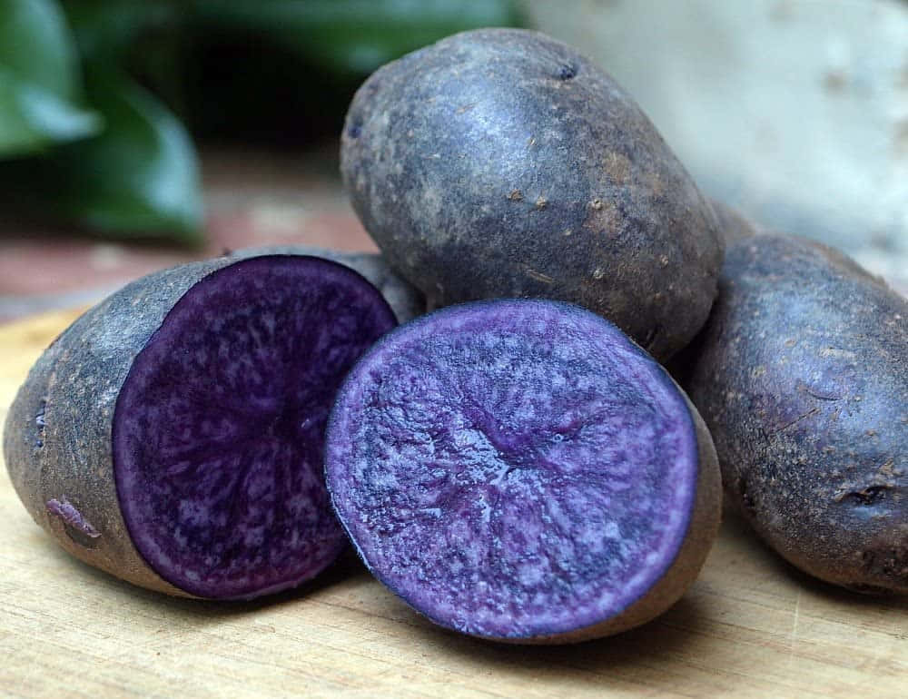A Colorful Purple Potato Ready to Brighten Up Your Plate Wallpaper