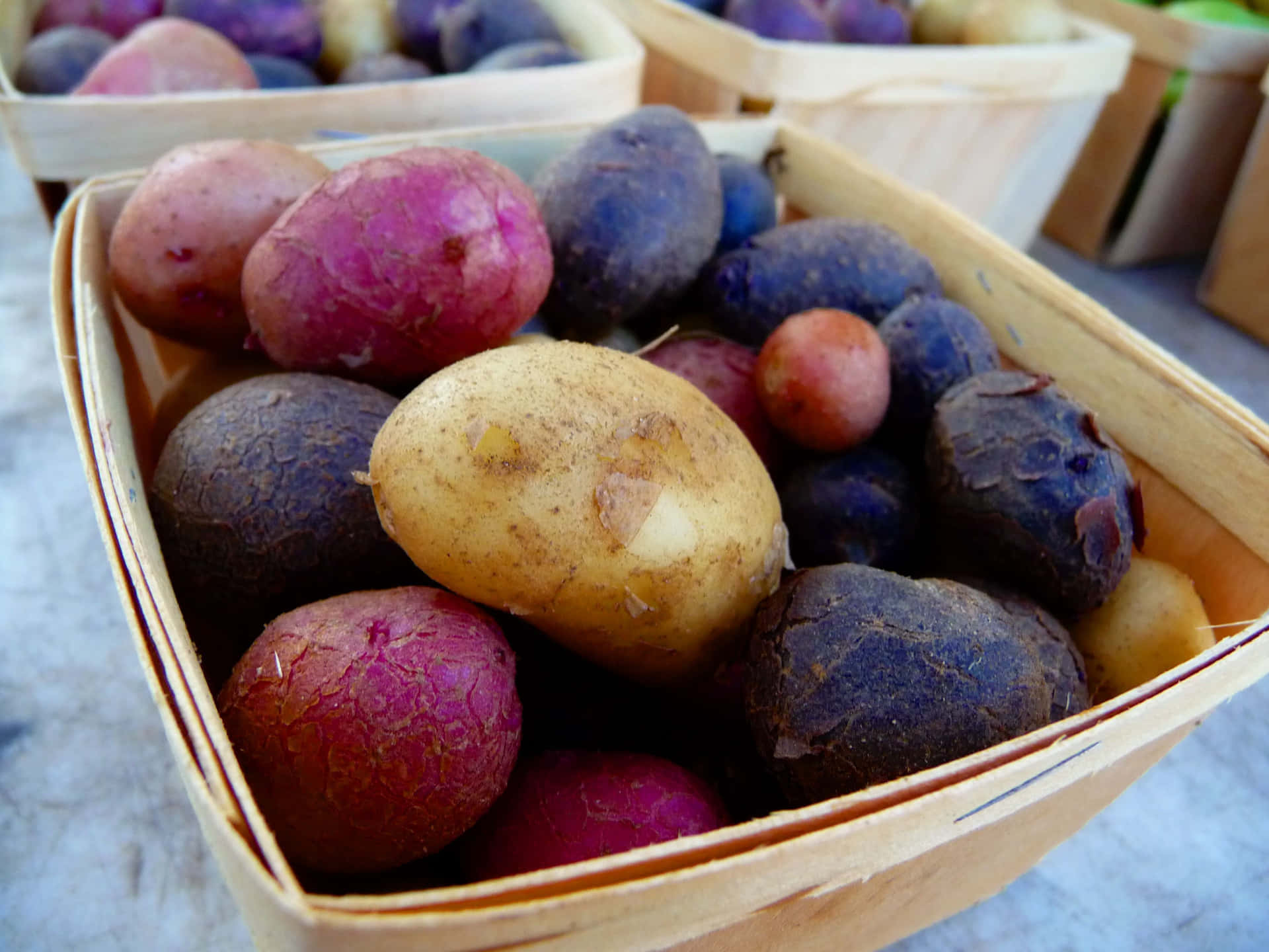 Deliciously Fresh Purple Potatoes - Perfect for Hearty Meals. Wallpaper
