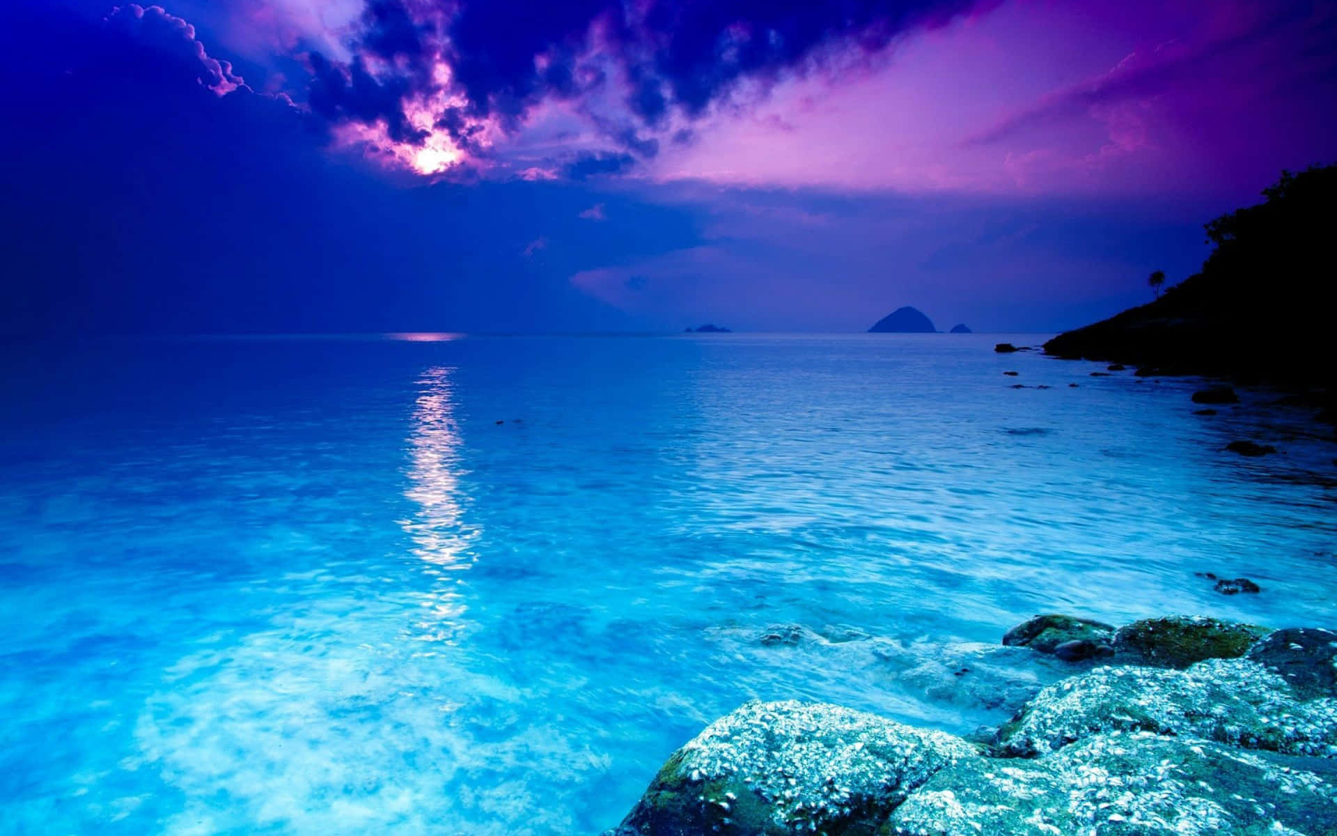 Purple Sky Over Serene Crystal Clear Water Wallpaper
