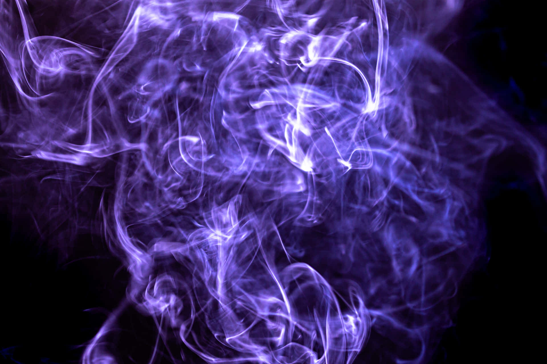 Purple Smoke On A Black Background