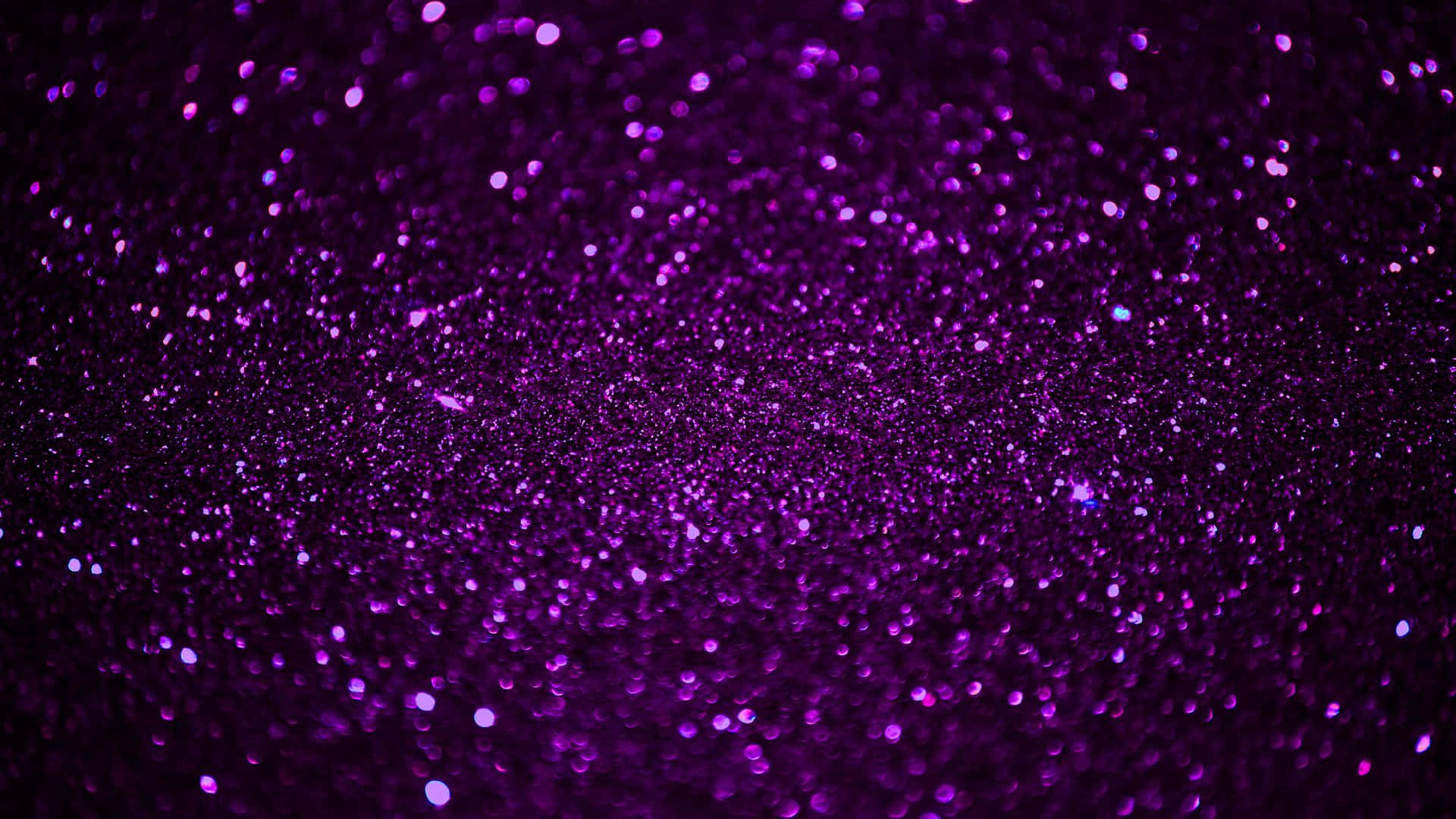"A brilliant background of purple sparkles"