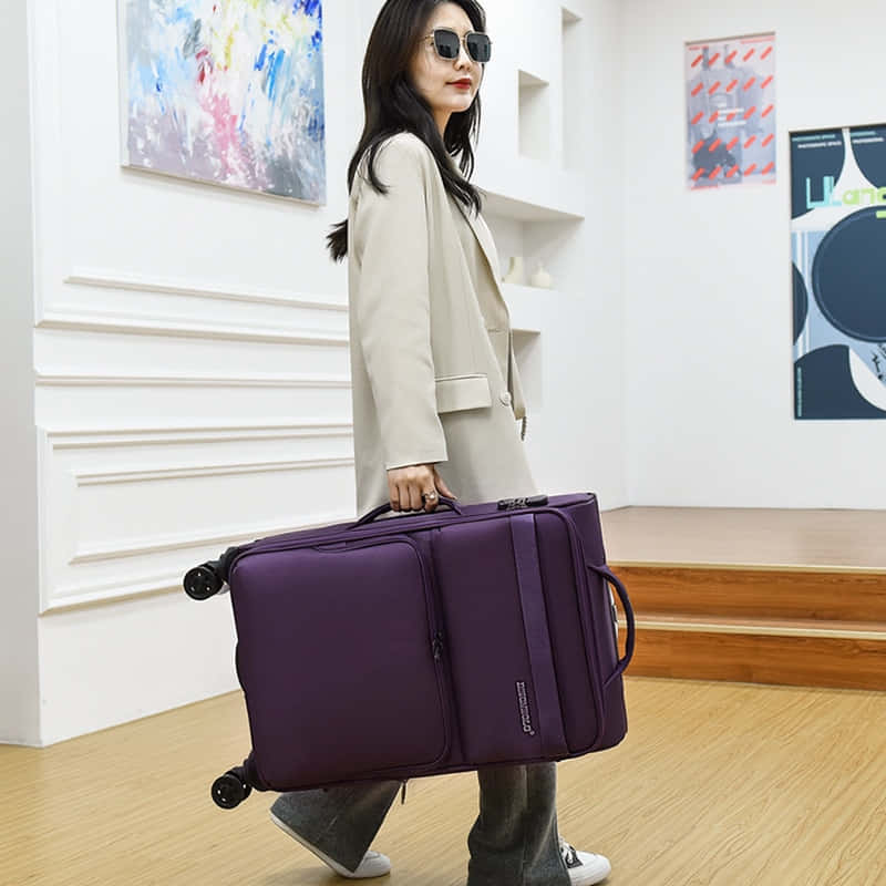 Travel in Style with this Stunning Purple Suitcase!" Wallpaper