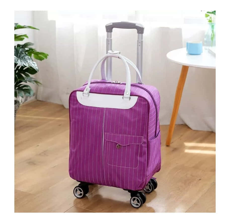 Get Ready For Your Adventure with a Purple Suitcase Wallpaper