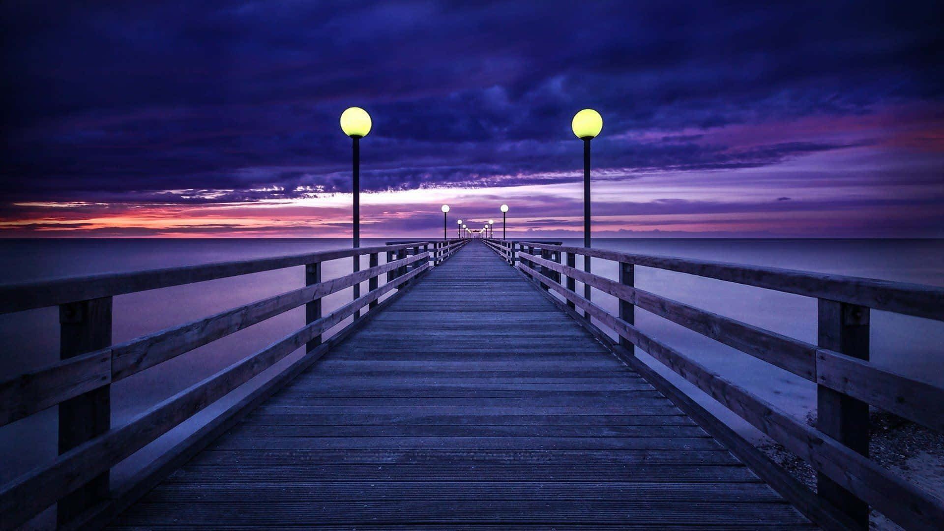 Serene Purple Sunset at the Coast Wallpaper