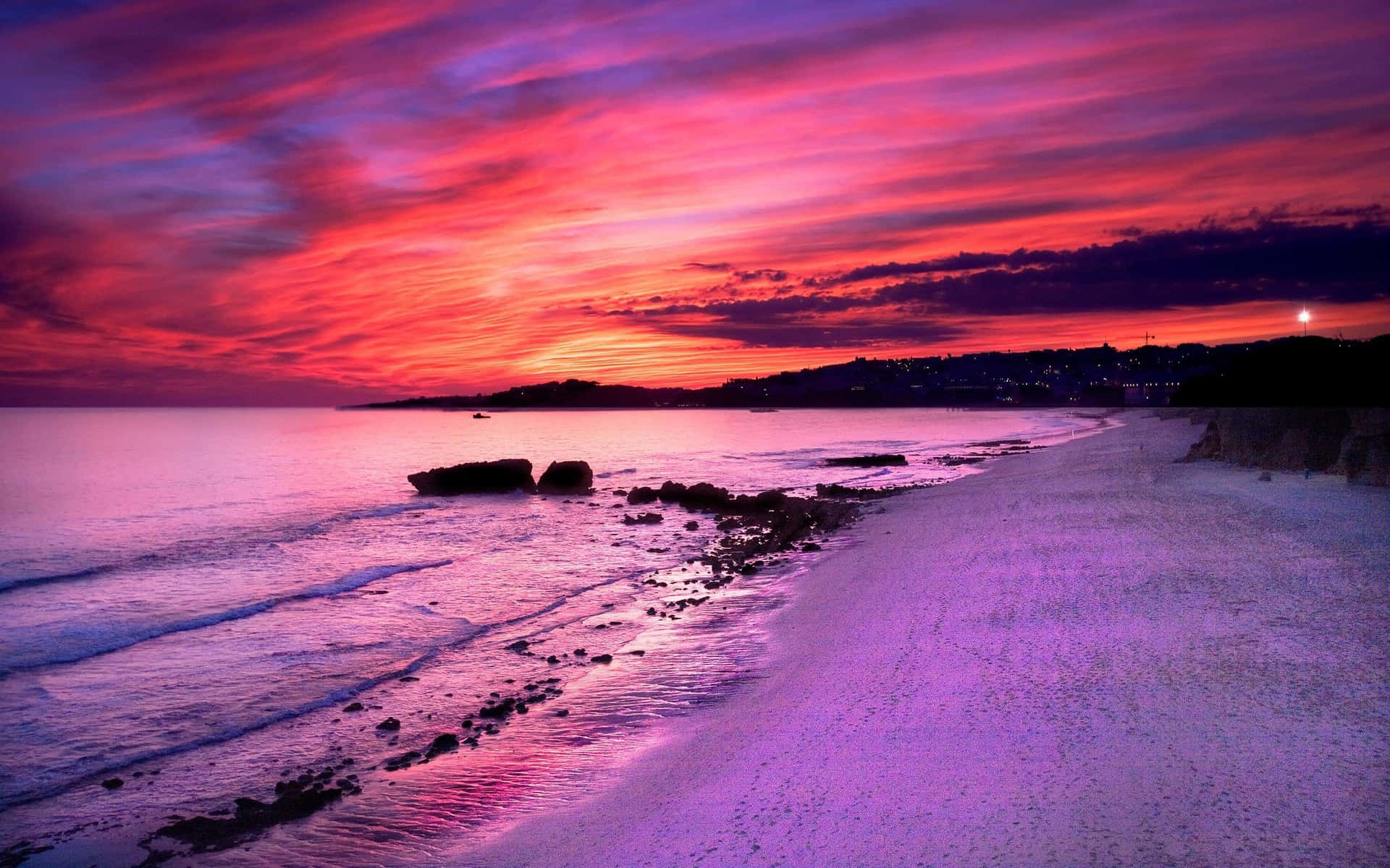 Magical Purple Sunset Over the Horizon Wallpaper