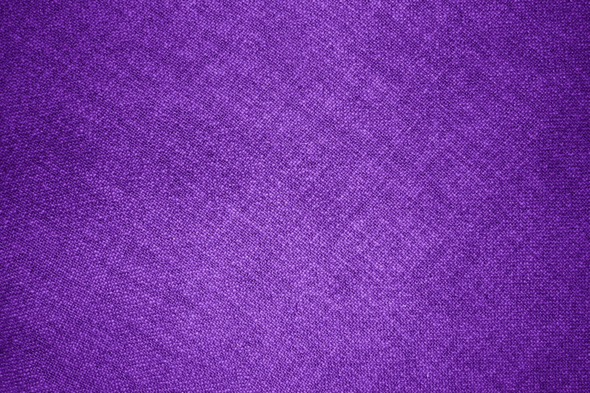 A bright, vibrant purple textured background.