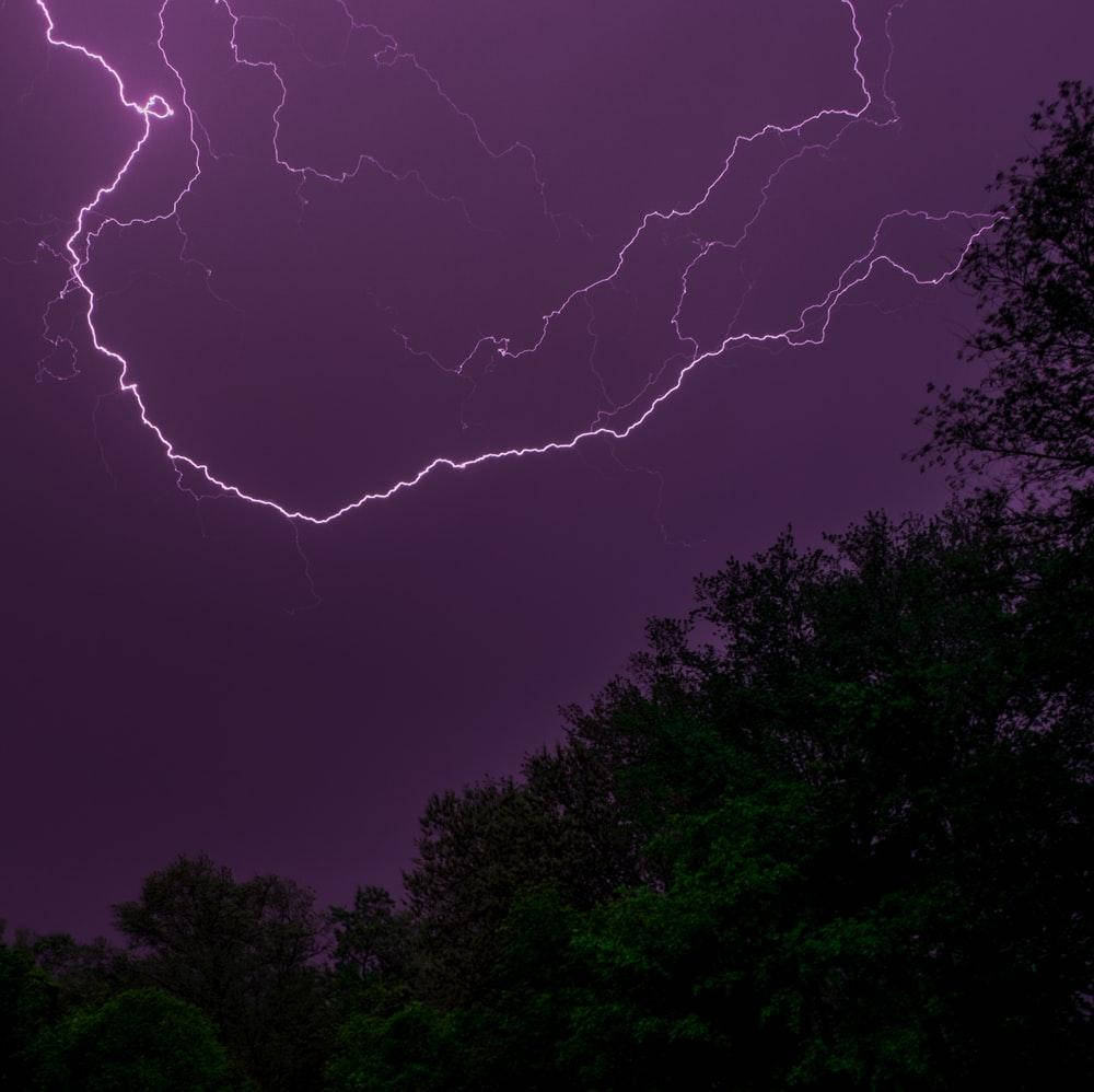 Purple Thunderstorm Over Trees Wallpaper