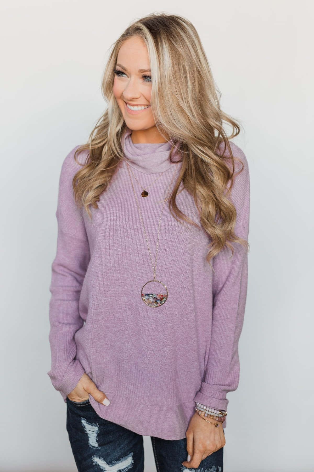 A classic and chic purple turtle-neck sweater is the perfect winterwear. Wallpaper