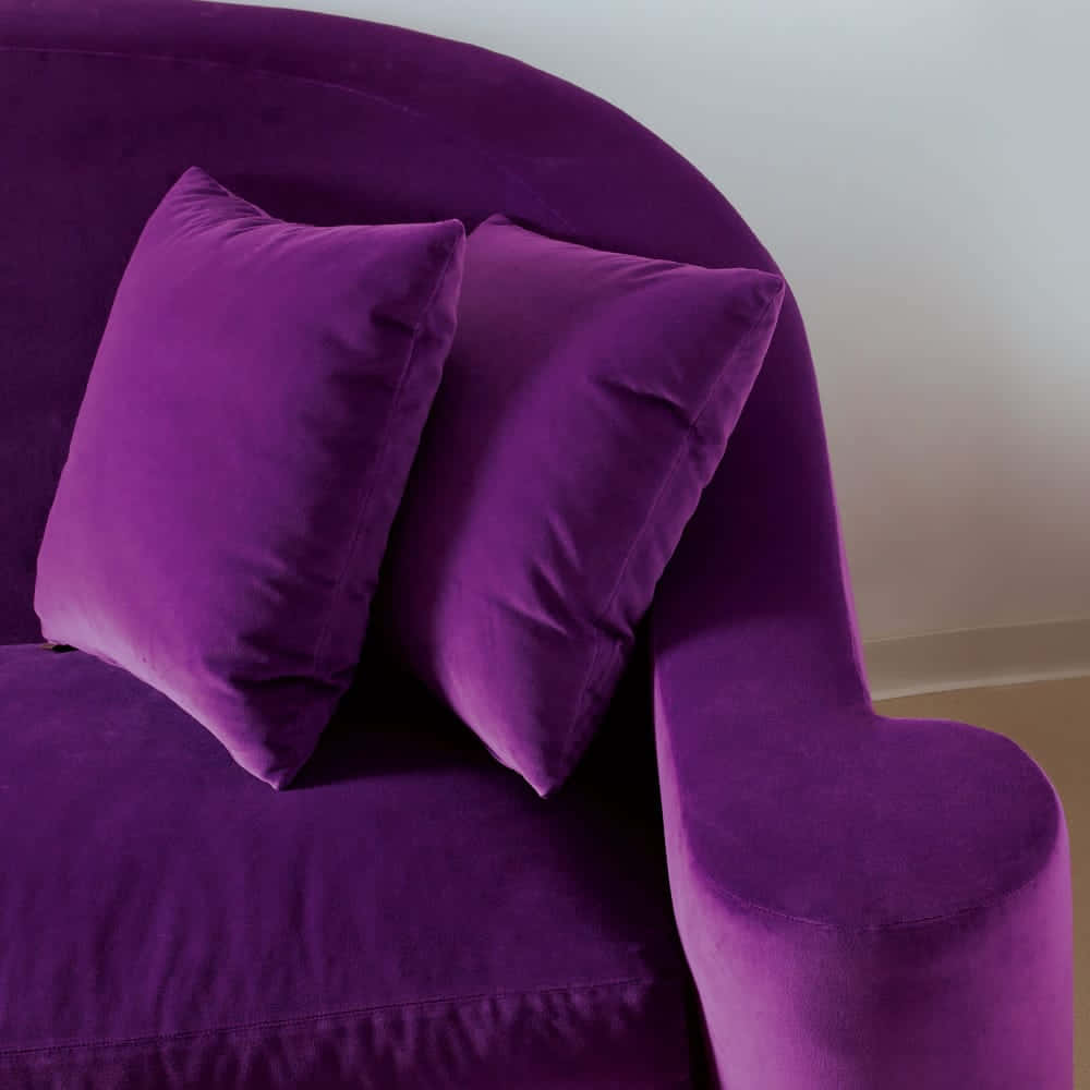Luxurious purple velvet fabric for a royal look Wallpaper