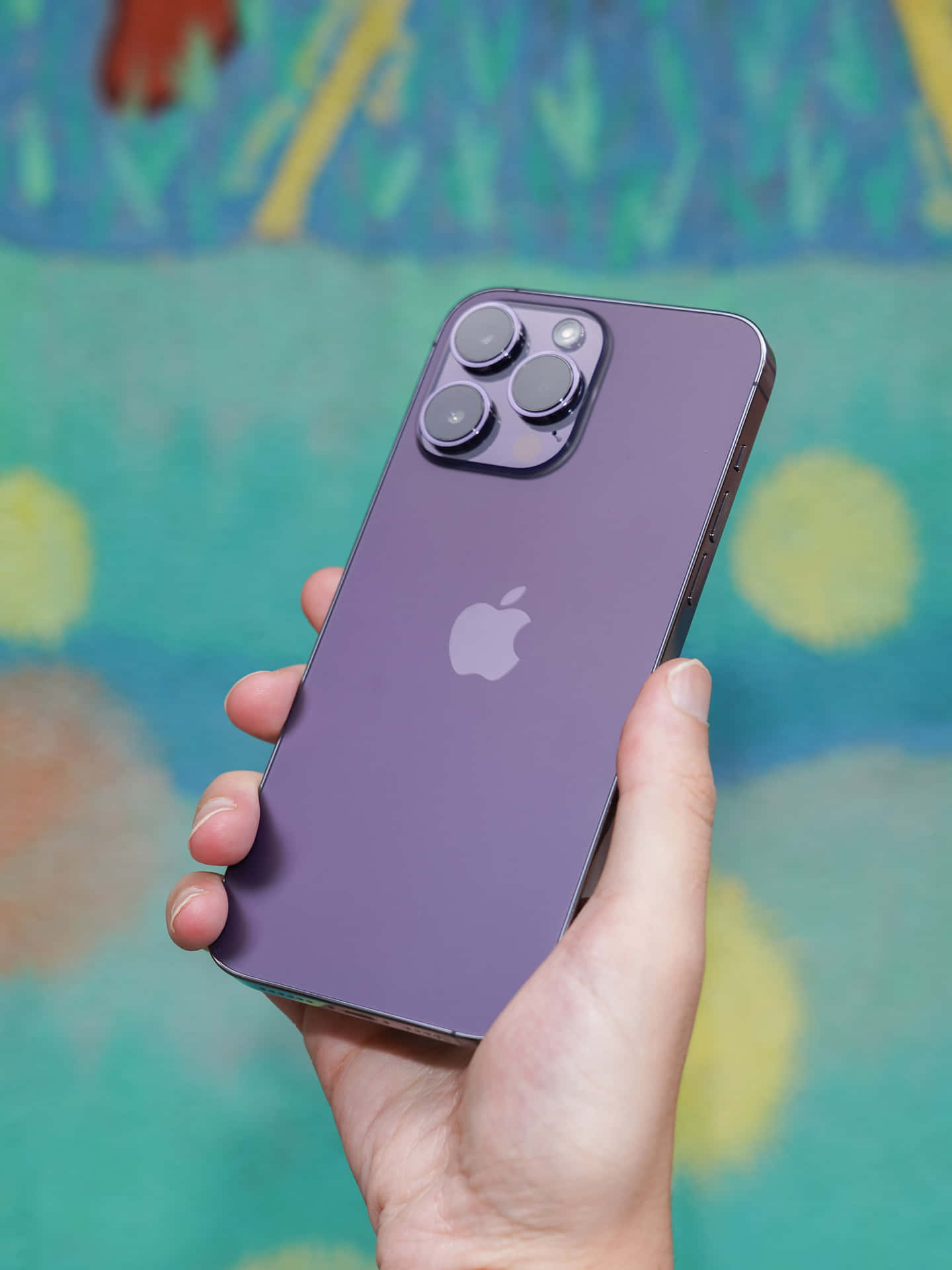 Purplei Phone14 Pro Maxin Hand Wallpaper