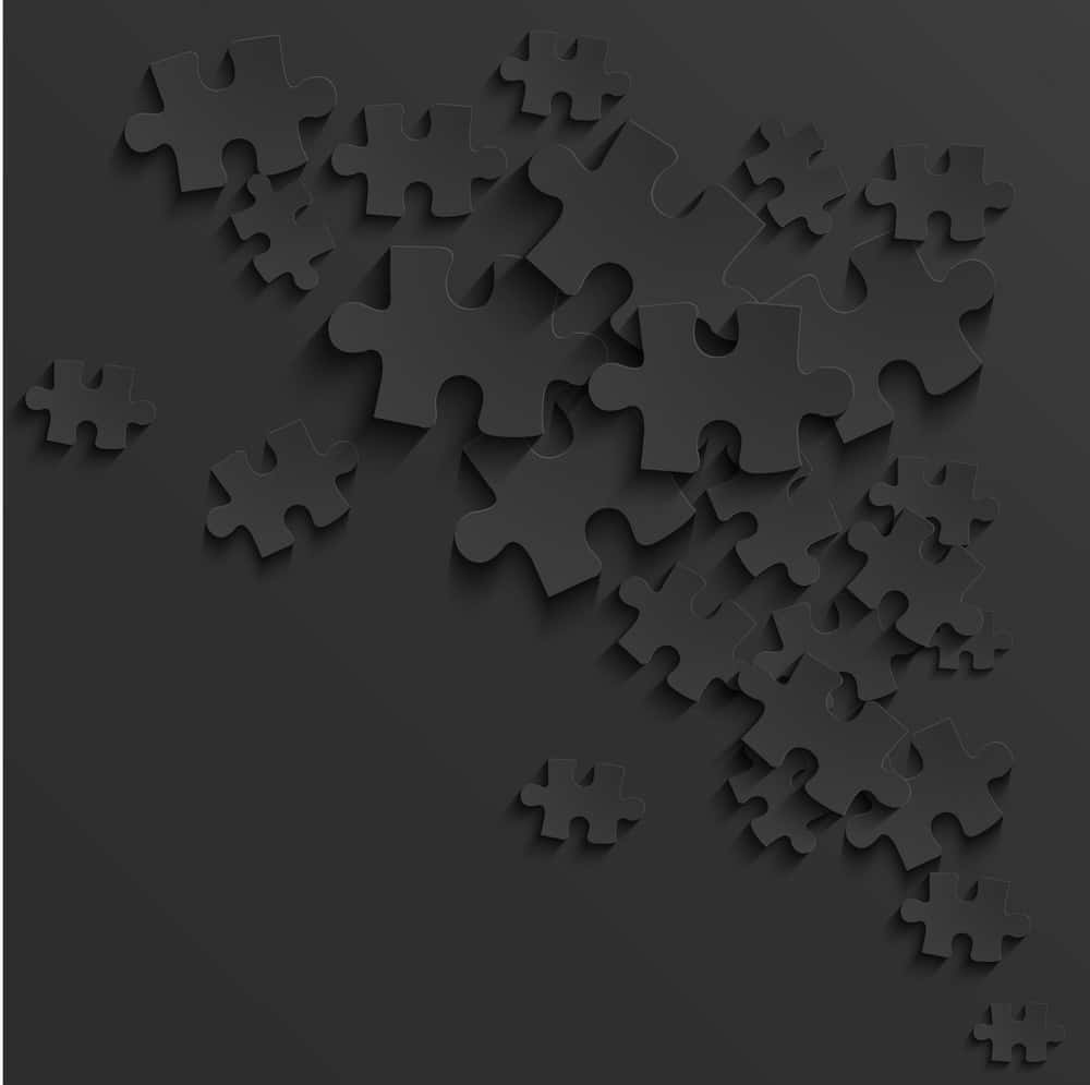 Black Puzzle Pieces On A Black Background Vector