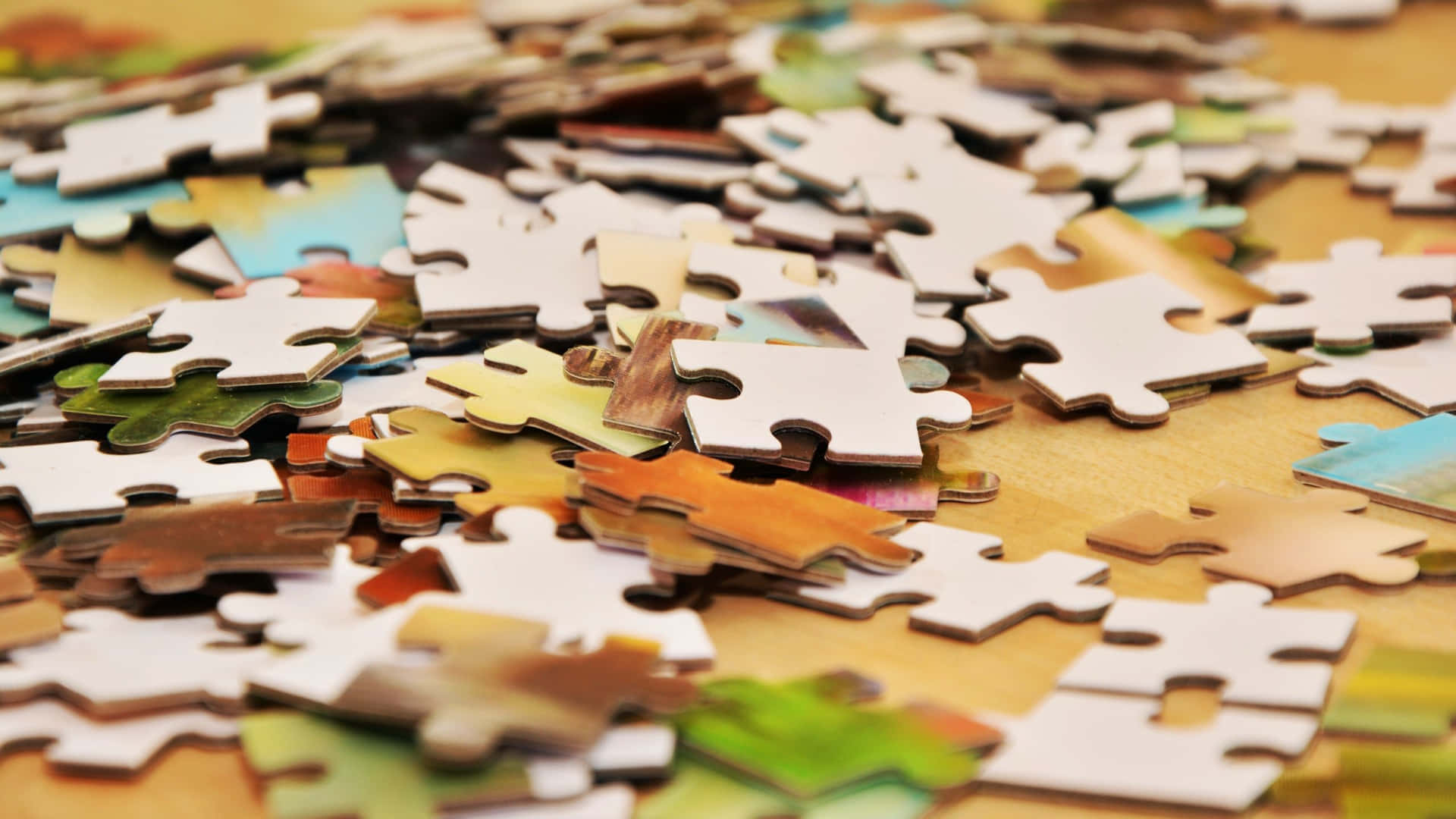 Colorful Jigsaw Puzzle Pieces Coming Together Wallpaper