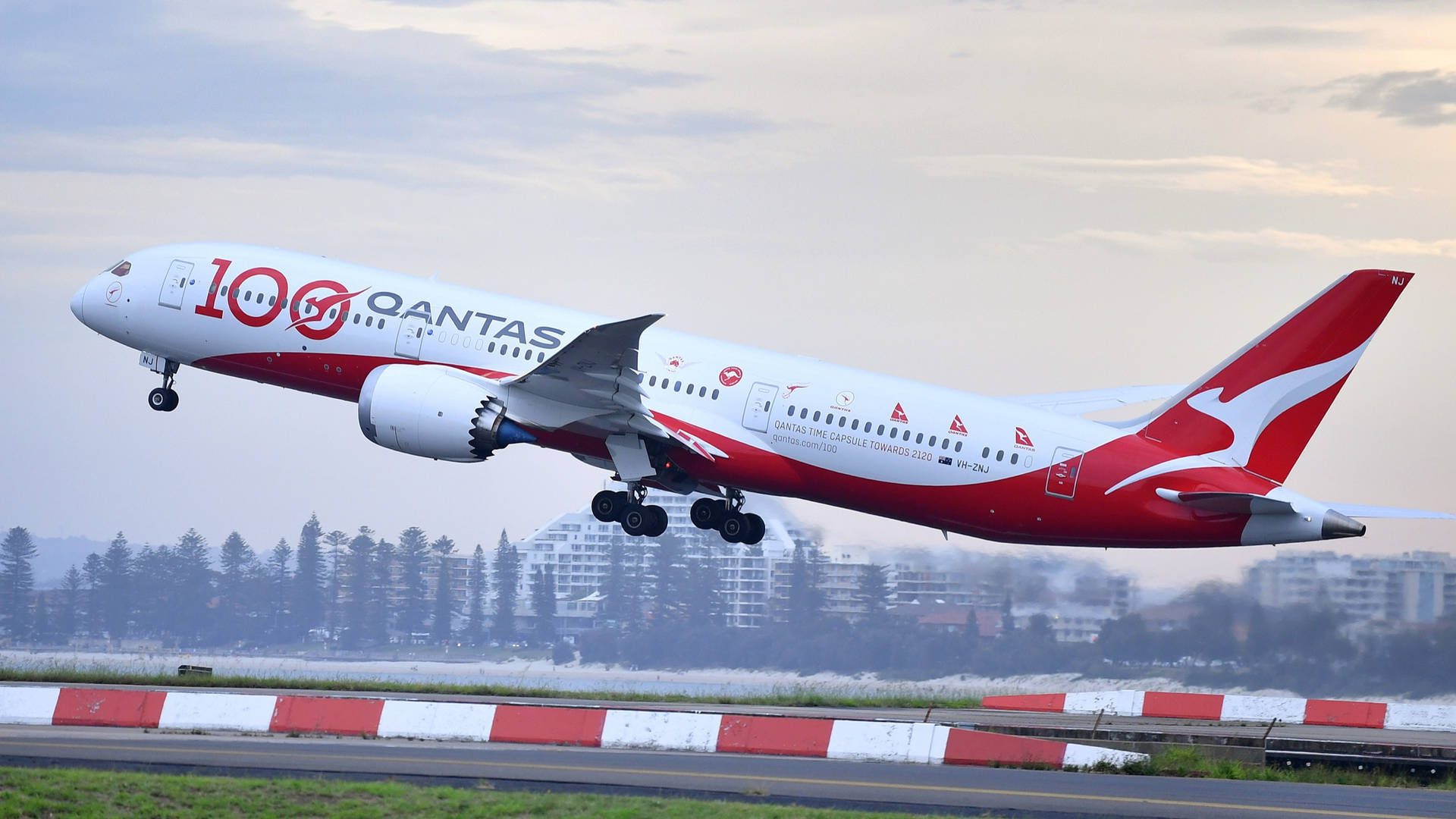 (this Would Likely Be The Caption For A Wallpaper Featuring An Image Of A Qantas Airplane Taking Off.) Wallpaper