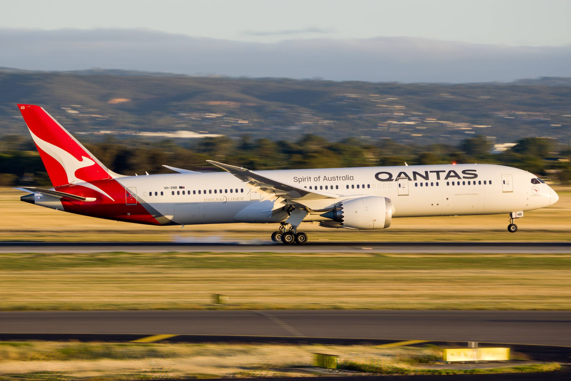 Qantas Airplane Speeding On The Runway Wallpaper