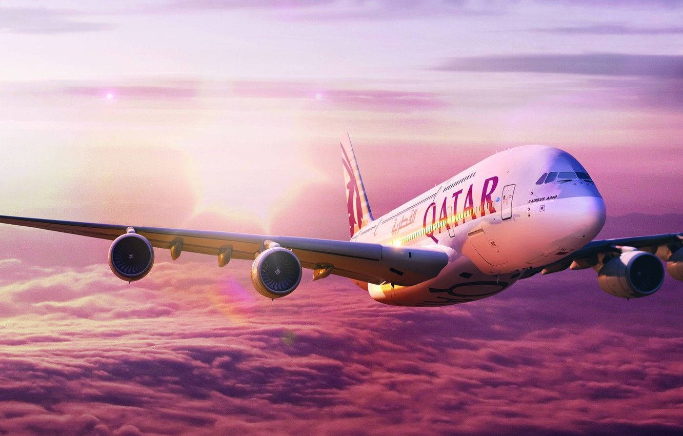 Caption: Majestic Qatar Airways Soaring Above Candy Floss Clouds Wallpaper