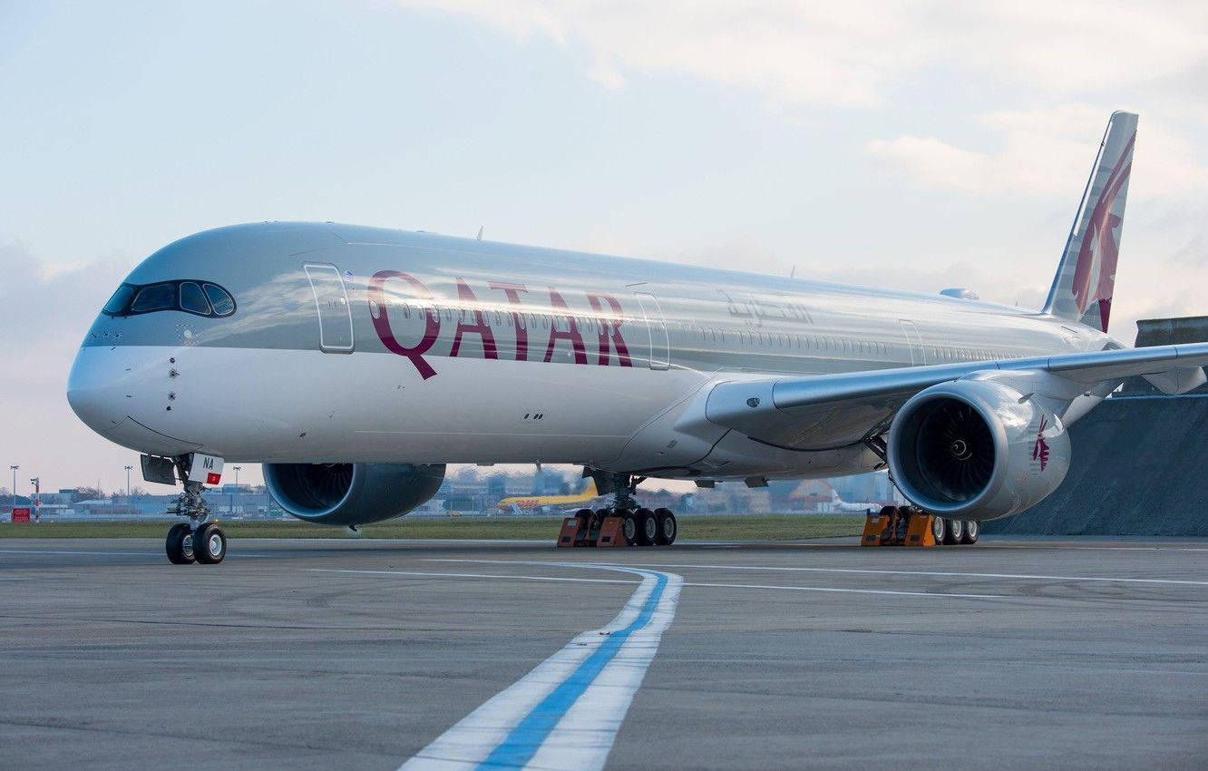 Qatar Airways Taxiing On The Runway Wallpaper