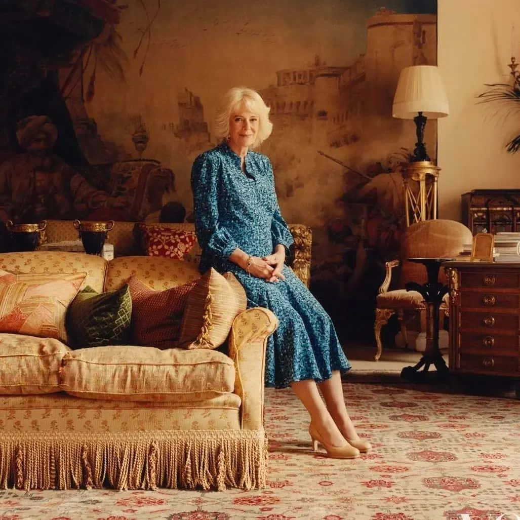 Queen Camilla Sitting On Sofa Wallpaper