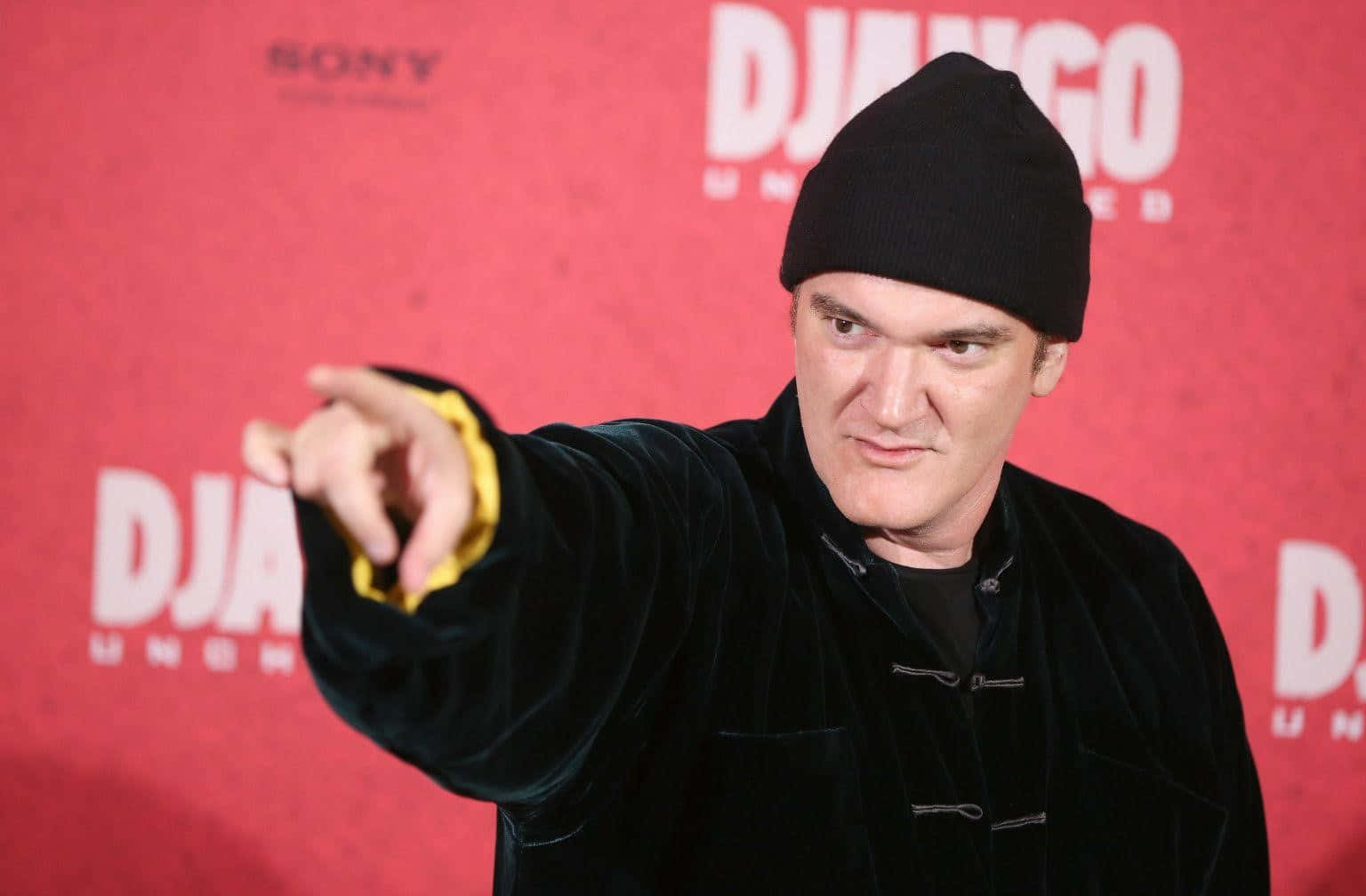 Quentin Tarantino Pointingat Event Wallpaper