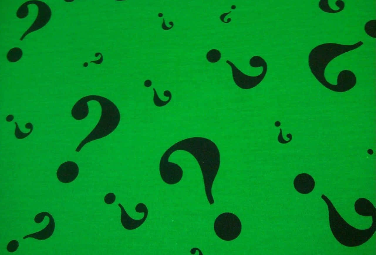A Green Fabric With Black Question Marks On It