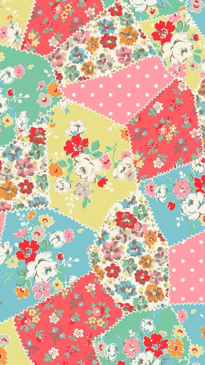 A Colorful Patchwork Fabric With Flowers And Polka Dots Wallpaper