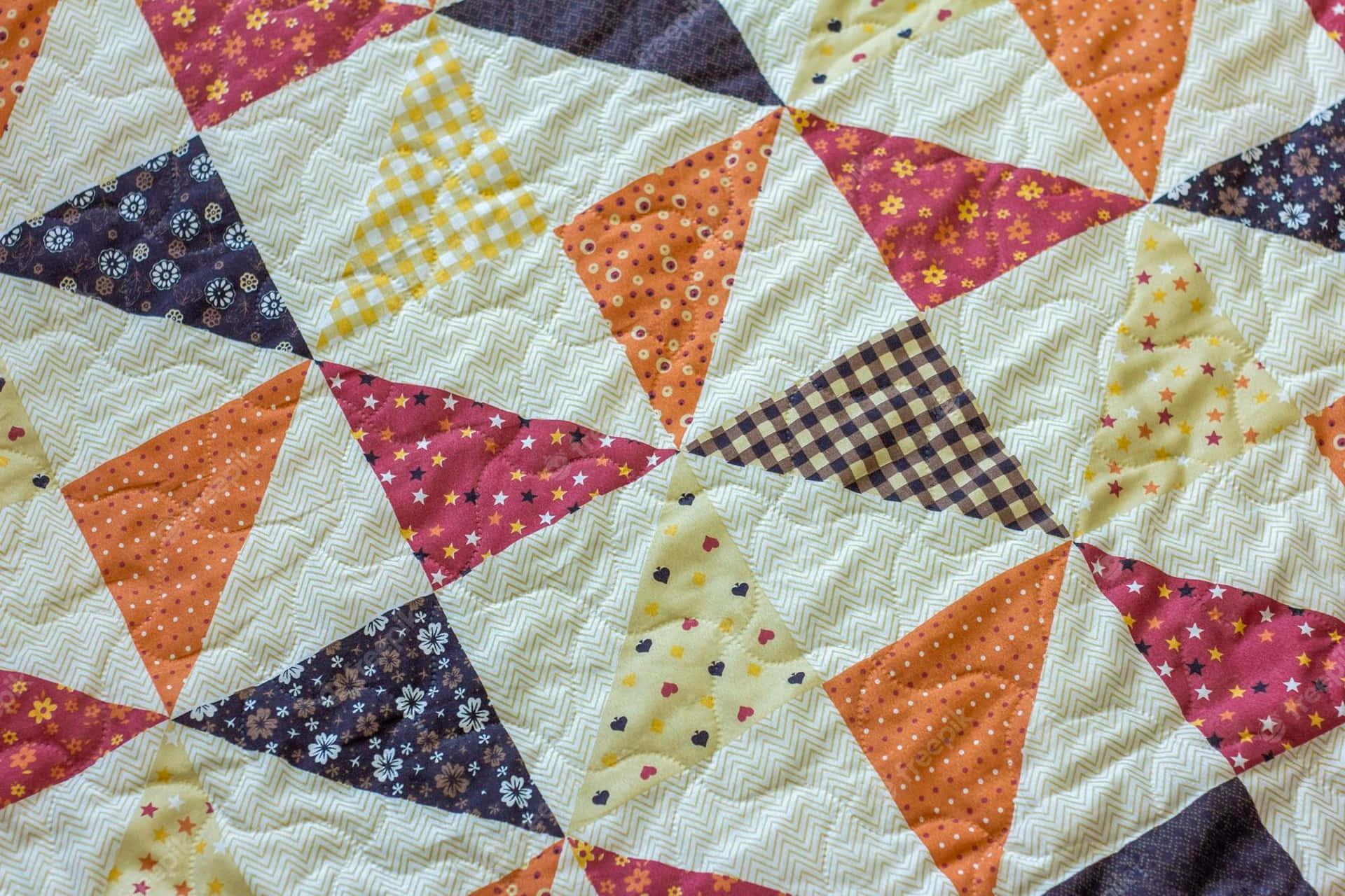 A intricately detailed patchwork quilt Wallpaper