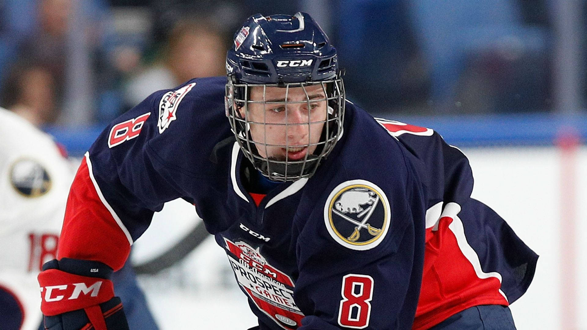 Quinn Hughes Elite Prospects Leaning Forward During Game Background