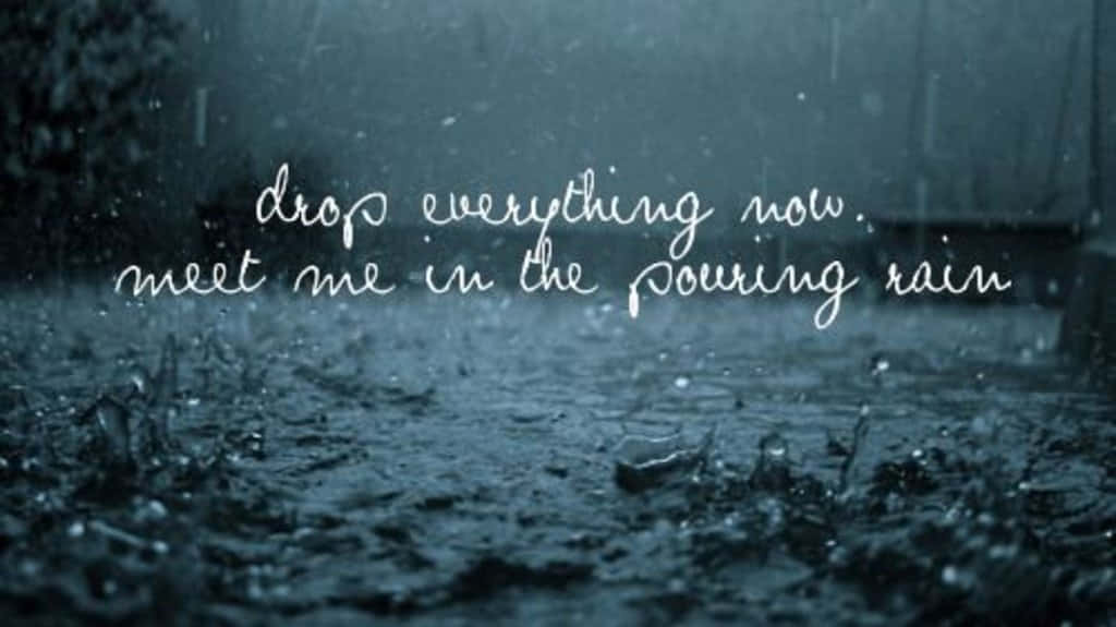 A Rainy Day With The Words, Everything Now Meet Me In The Pouring Rain Wallpaper