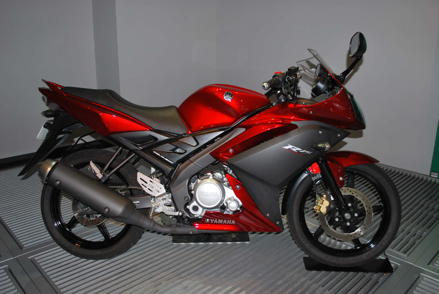 A Red Motorcycle On A Platform